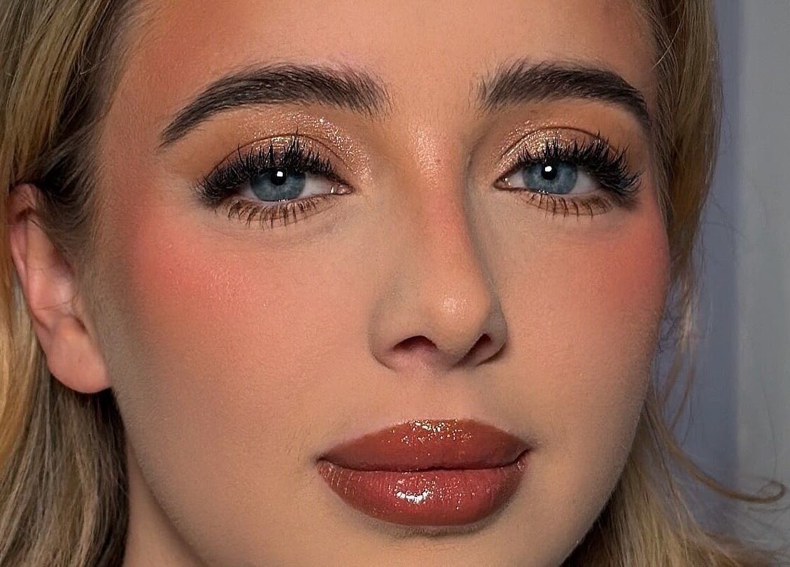 Glamour makeup by Makeupbykian in Liverpool, England, GB highlighting bold eyes and glossy lips.