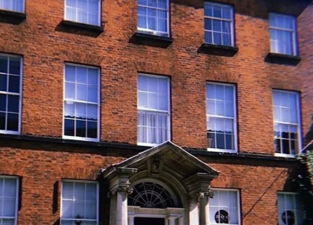 Charming brick facade of Makeupbykian, a beauty venue in Liverpool, England, GB, showcasing classic window designs.