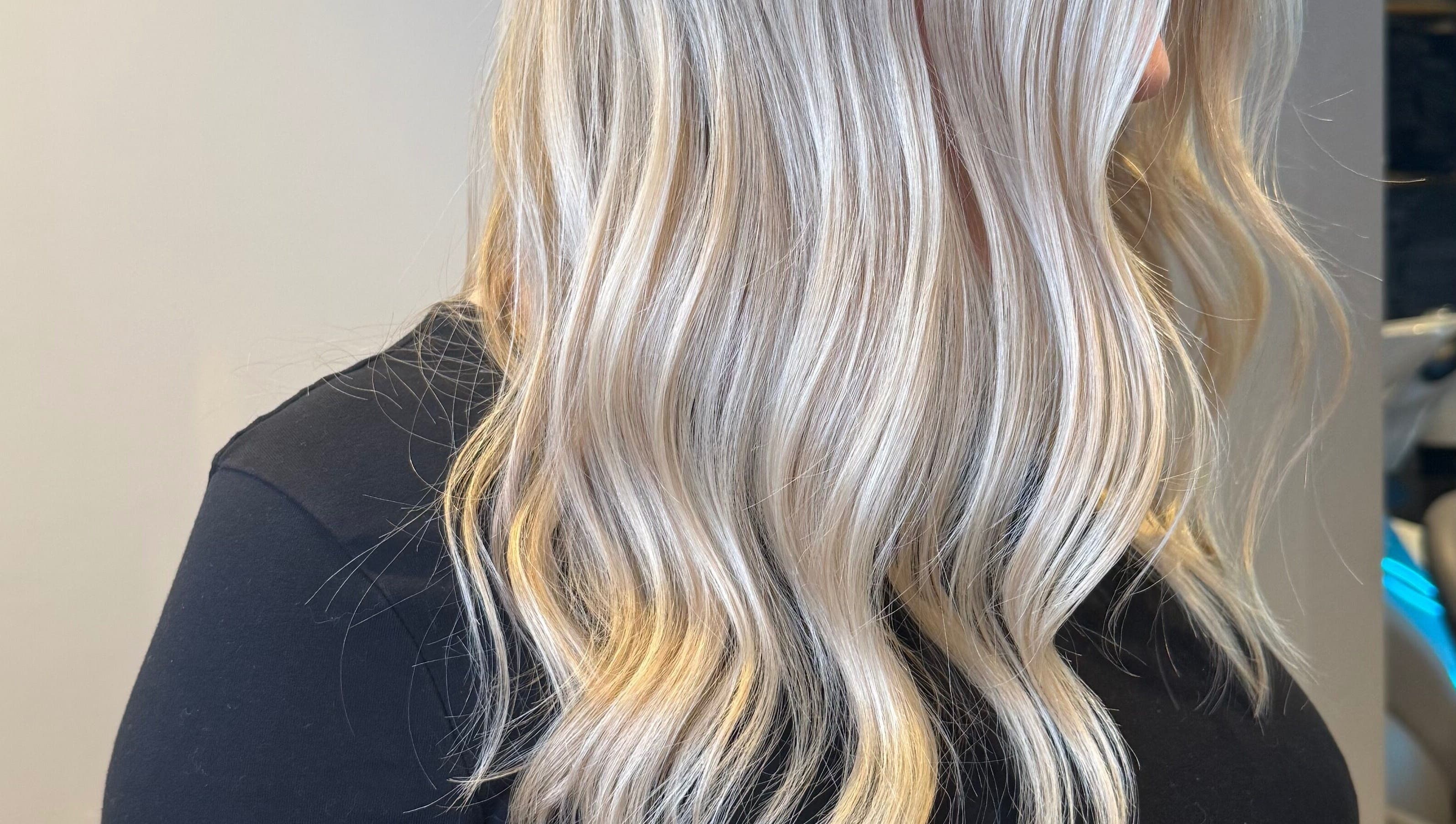 Elegant blonde waves styled at Sara_Hair_blonde in London, England, GB, showcasing professional hairdressing.