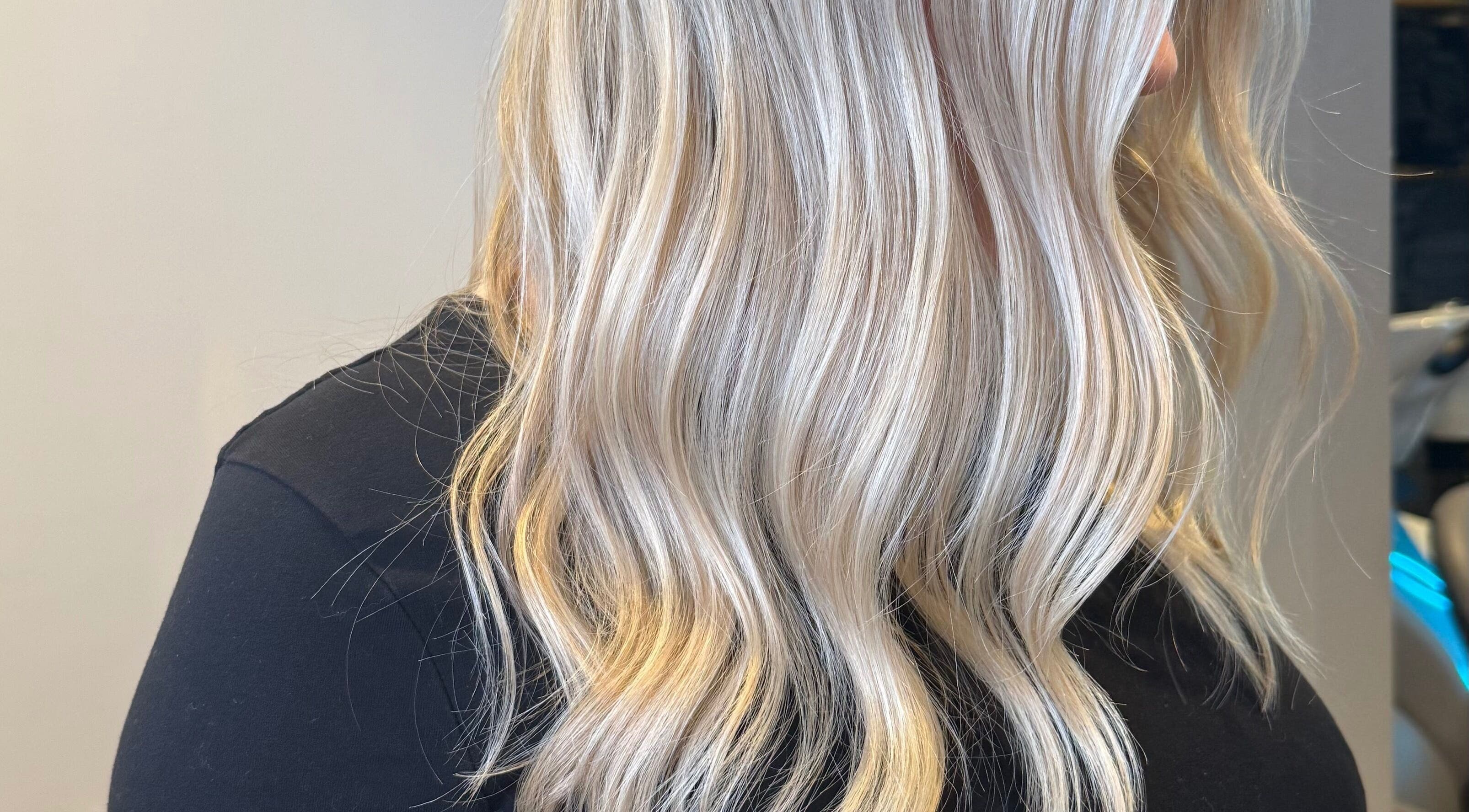Elegant blonde waves styled at Sara_Hair_blonde in London, England, GB, showcasing professional hairdressing.