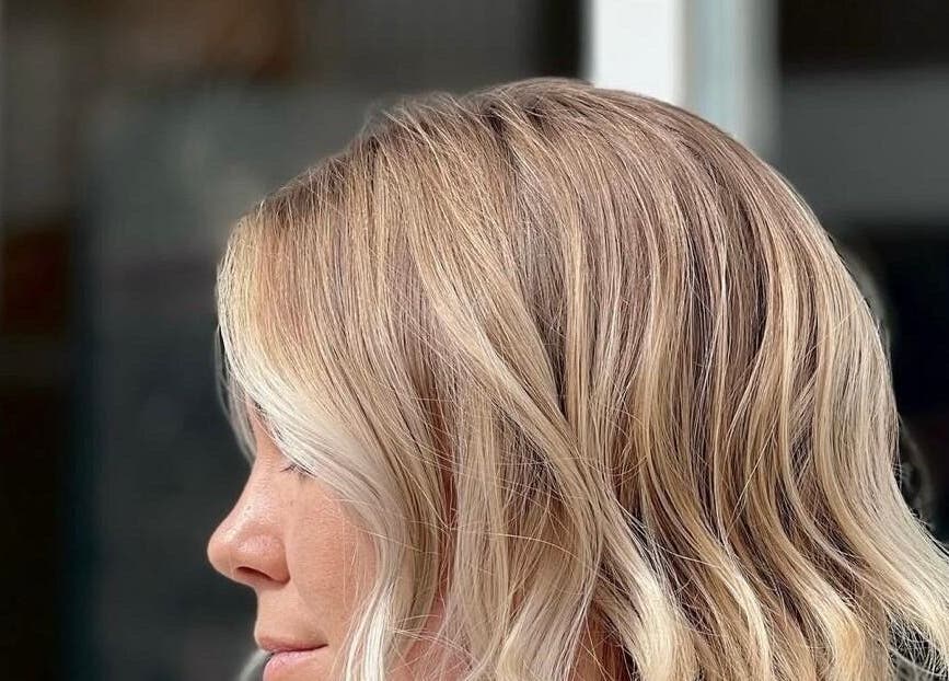 Blonde hair styled in soft waves at Amanda Mancio at Glamhouse Salon & Spa, Puerto Vallarta, Jalisco, MX.