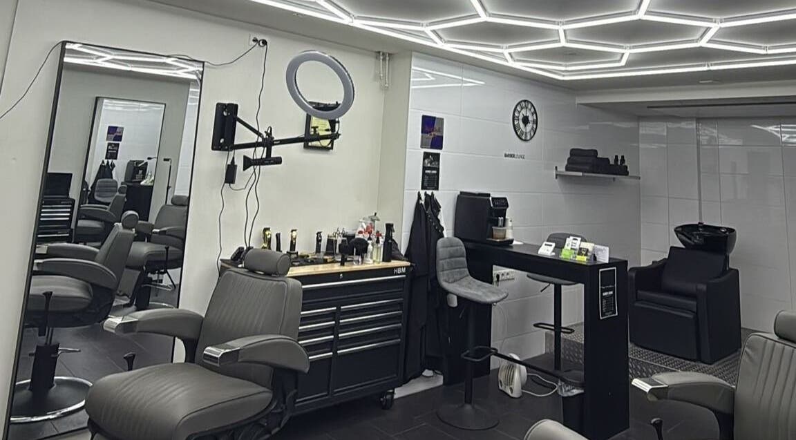 Modern interior of Barber Lounge in Heerlen, Limburg, NL, featuring sleek barber chairs and stylish decor.