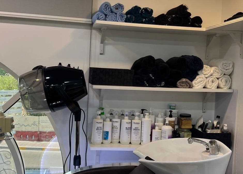 Hair care area at Du Monde Ladies Beauty Salon in Abu Dhabi, AE with modern sink and grooming products.