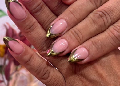 Elegant nail art with golden tips at Nailsbyflor, New York, New York, US, showcasing chic manicure designs.