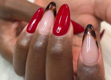 Chic red and black nail art at Nailsbyflor, New York, New York, US. Perfectly styled fingertips.