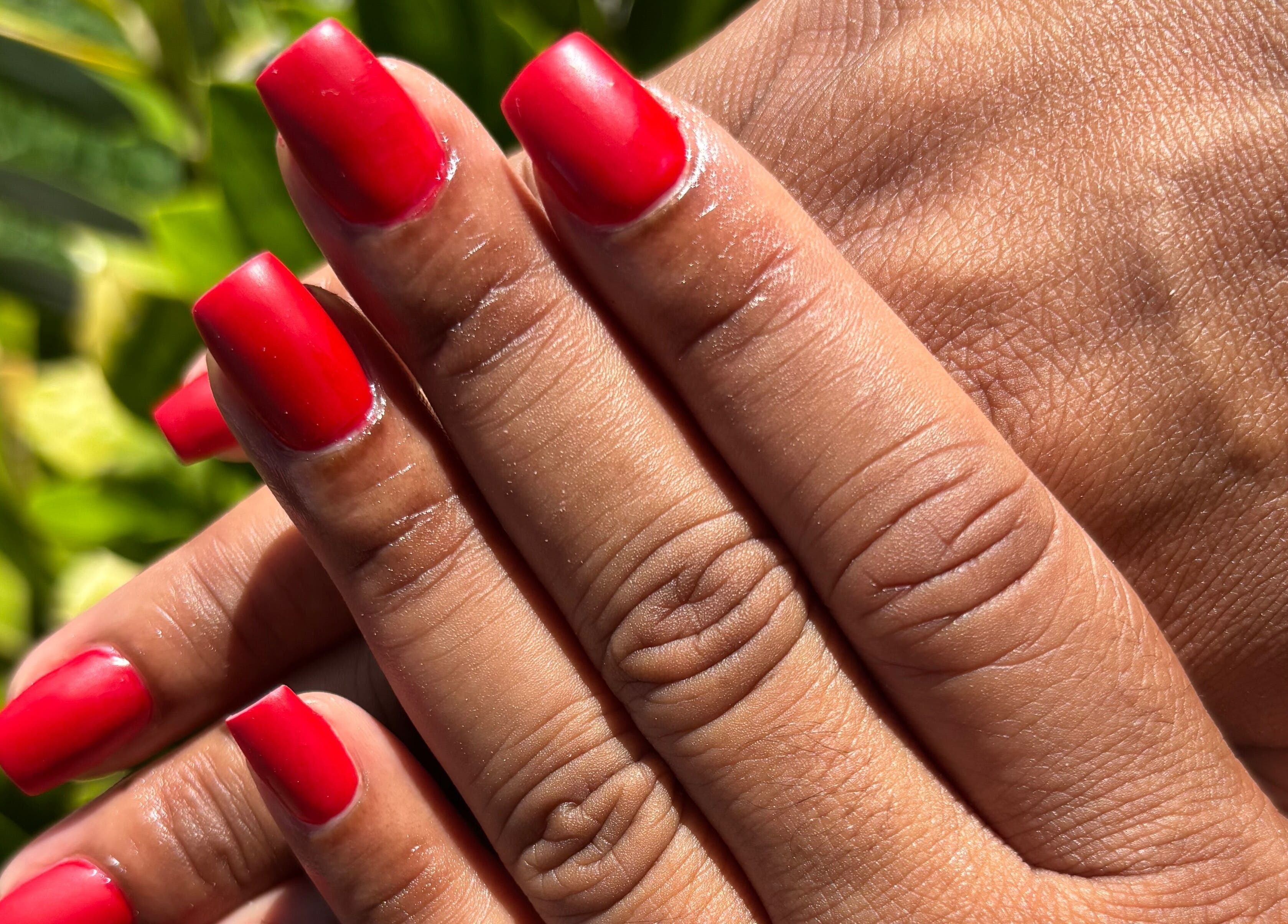 Vibrant red nails at Eunoia Studio, Saint John's, Saint John, AG.
