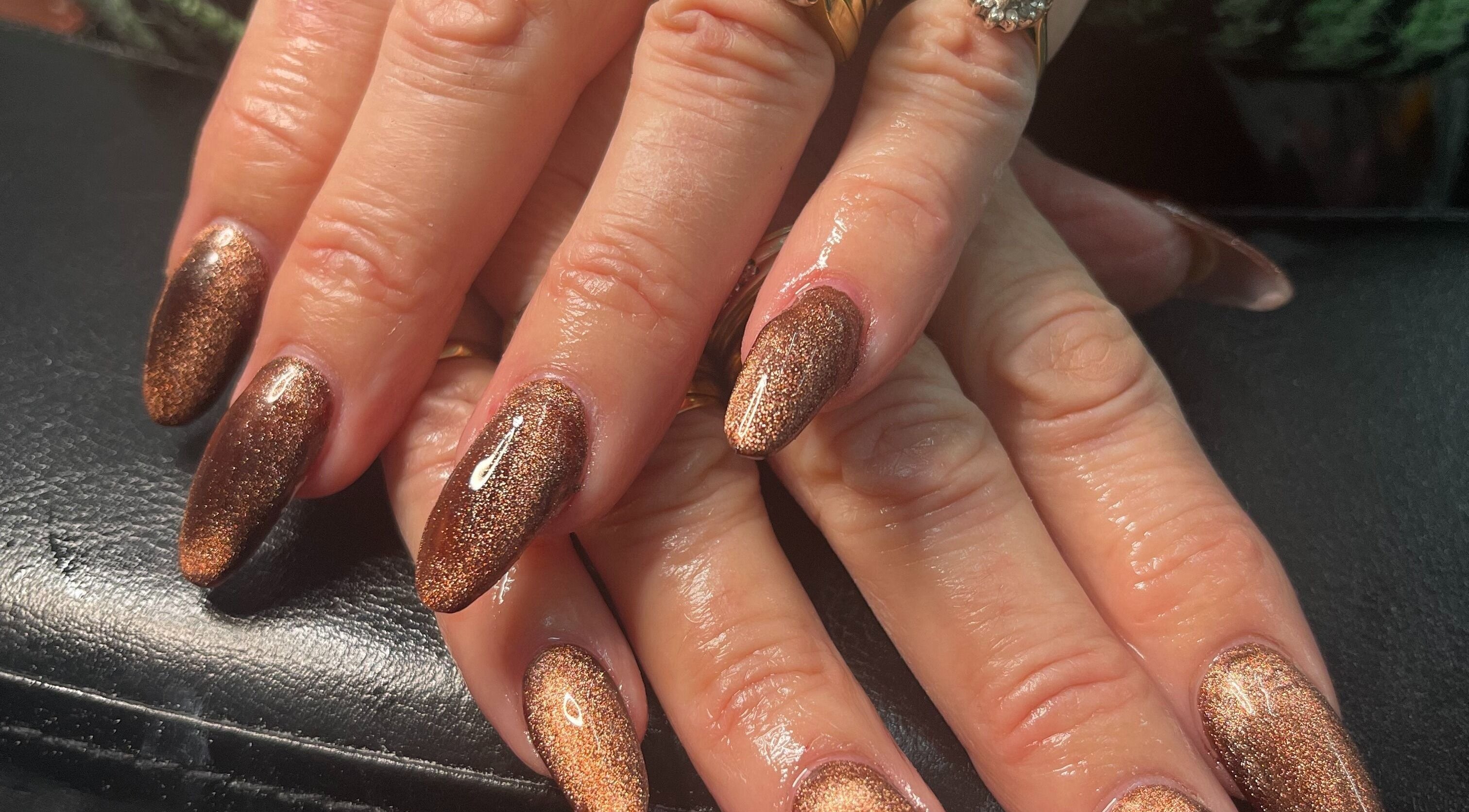 Shimmering bronze nails at Nails For Days in Porthcawl, Wales, GB, highlighting expert nail artistry.