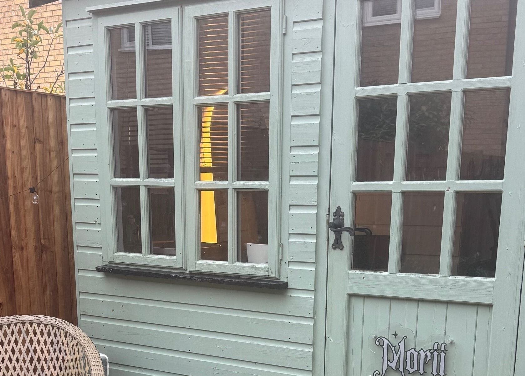 Charming Morii Tattoos entrance at Great Notley, England, featuring vintage decor and inviting wooden door.