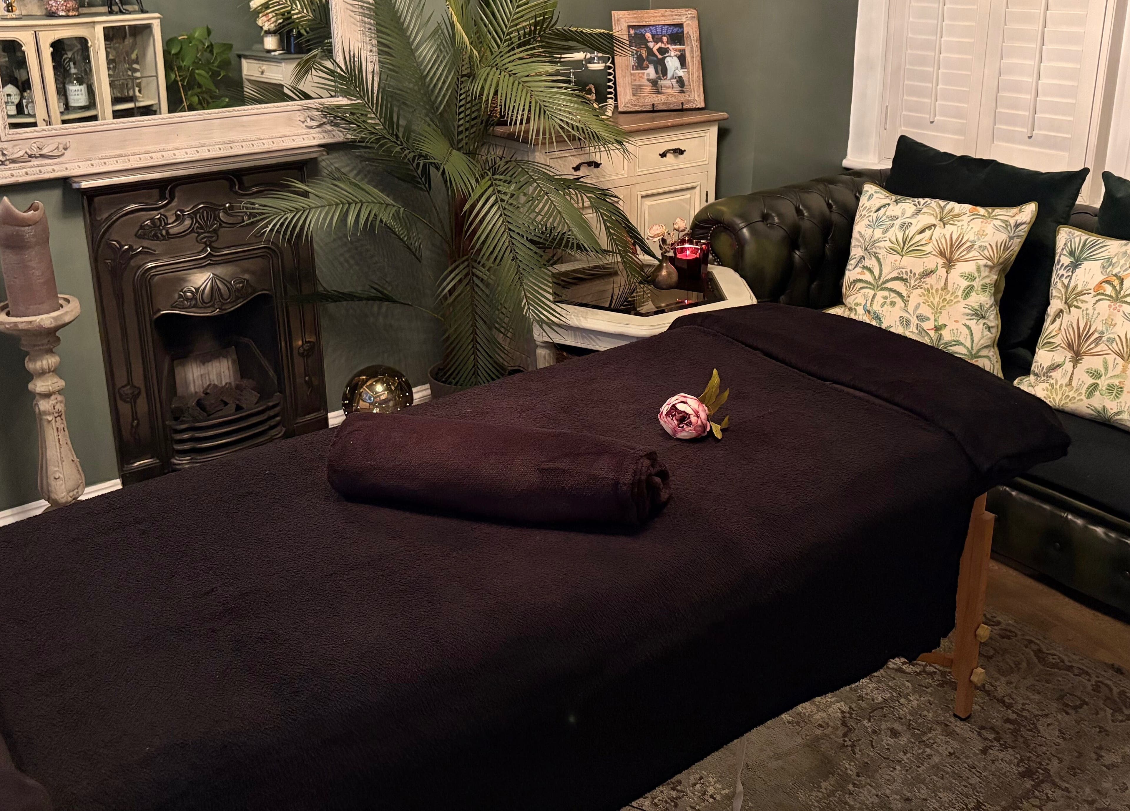Relaxing massage room at Anna Mason Massage Therapy, Bromley, England, GB with cozy decor and plush furnishings.