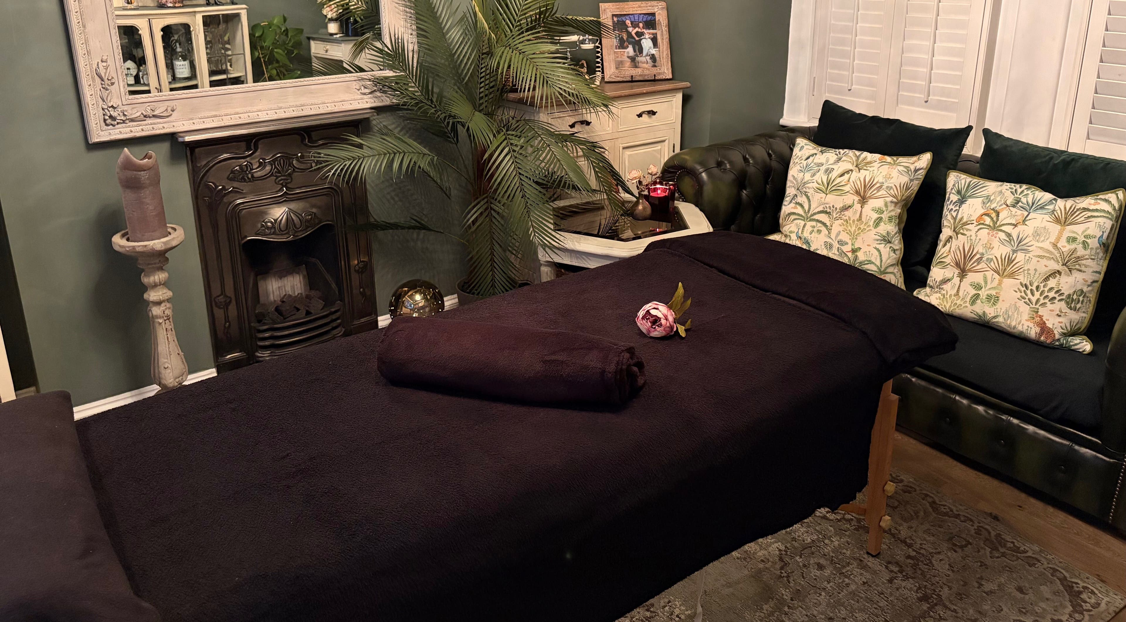 Relaxing massage room at Anna Mason Massage Therapy, Bromley, England, GB with cozy decor and plush furnishings.