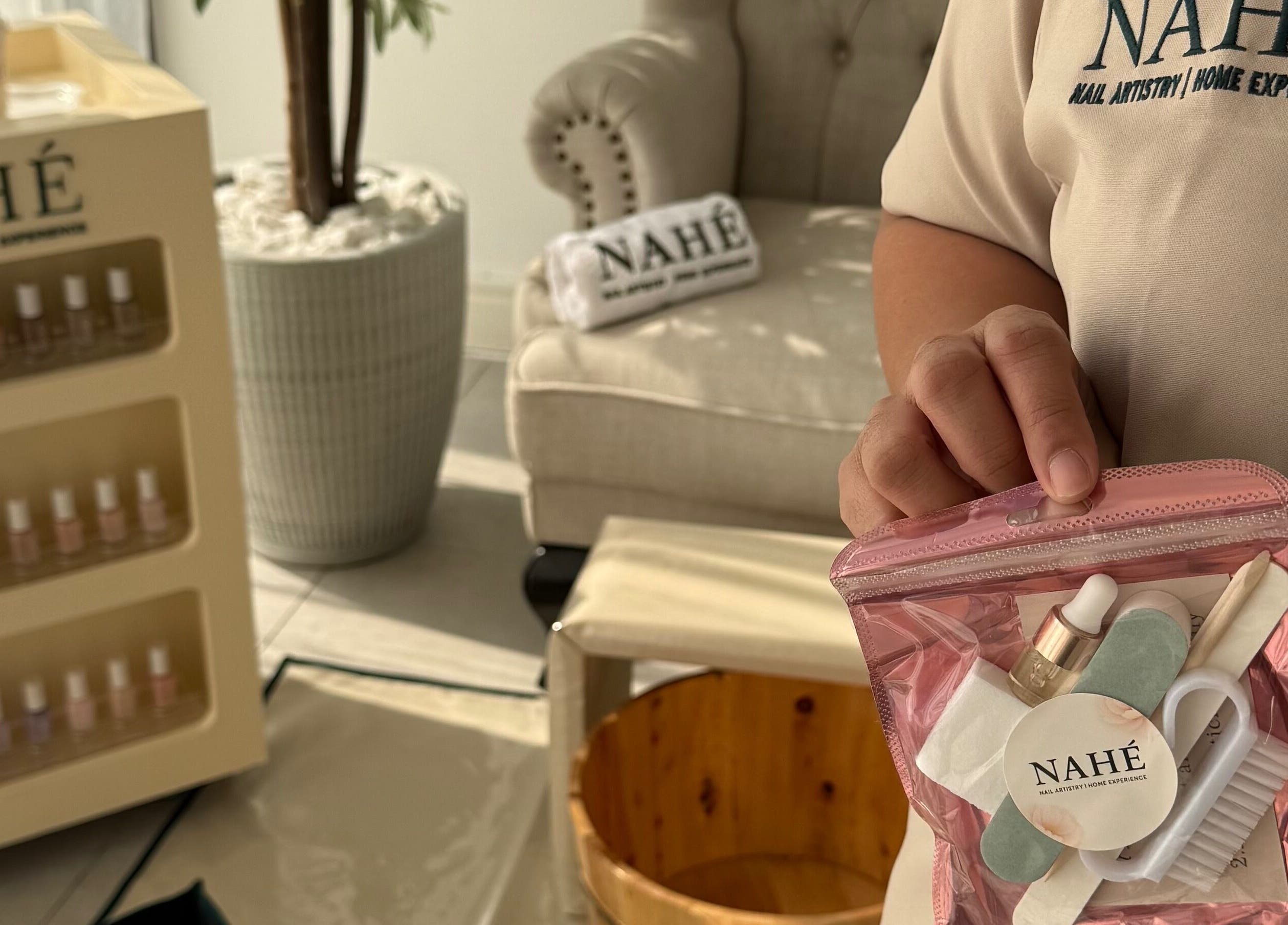 Nahé Beauty Home Service Salon pamper kit and nail polishes in Dubai, AE setting.