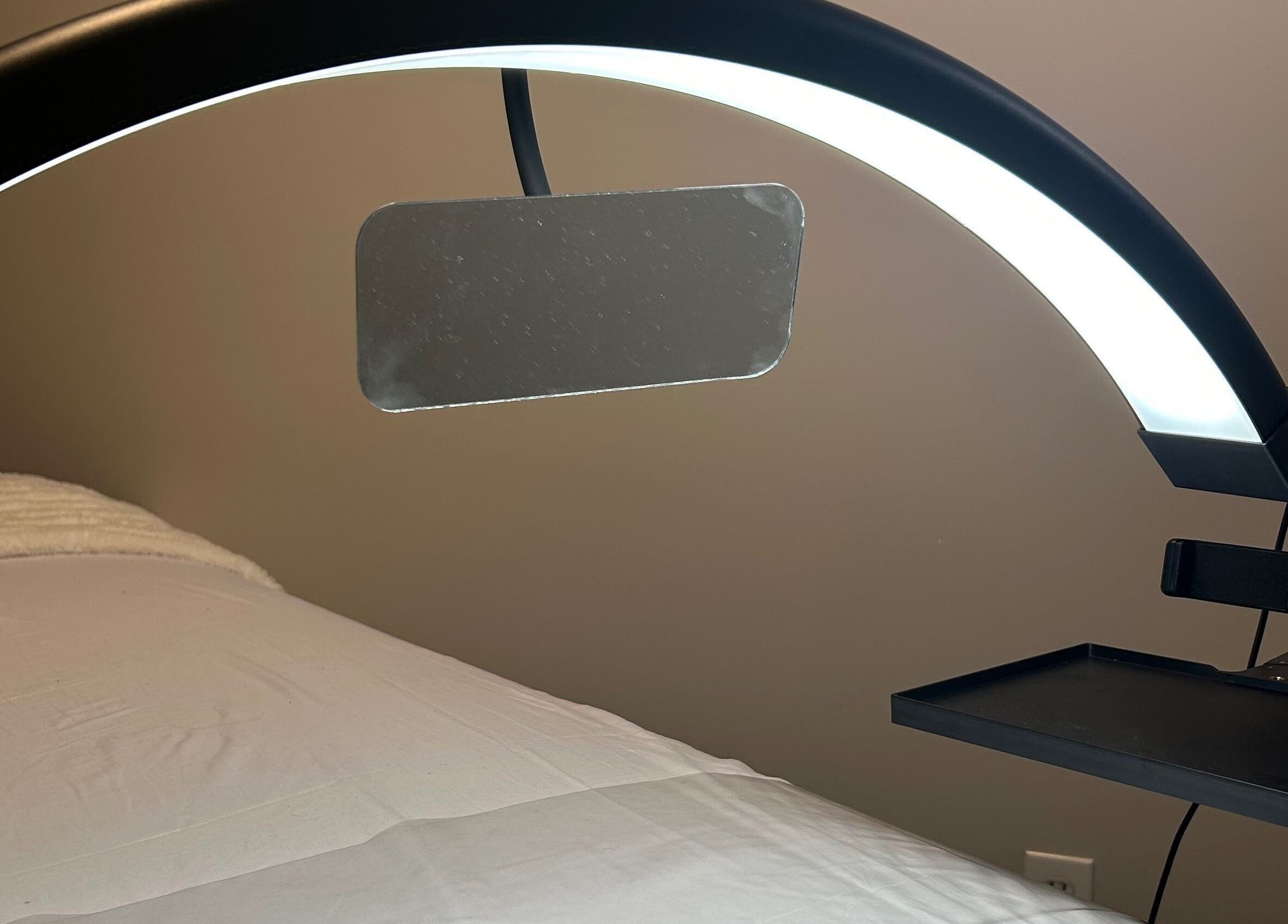 Relaxing treatment room at Advanced Beautique, Vaughan, Ontario, CA with modern lighting and a comfortable bed.