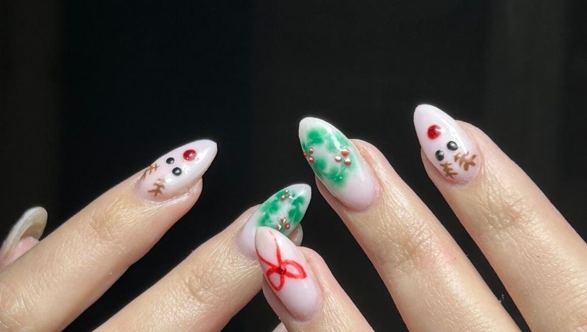 Festive nail art at bygeorgiamary in Bristol, England, GB, featuring holiday designs and vibrant colors.