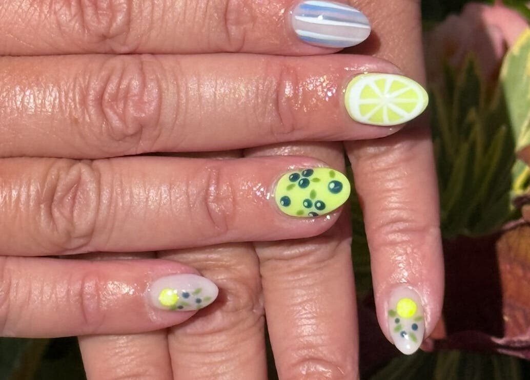 Colorful fruit-themed nails at Glimmer Nail Studio, Oshkosh, Wisconsin, US.