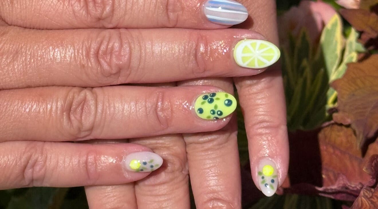 Colorful fruit-themed nails at Glimmer Nail Studio, Oshkosh, Wisconsin, US.