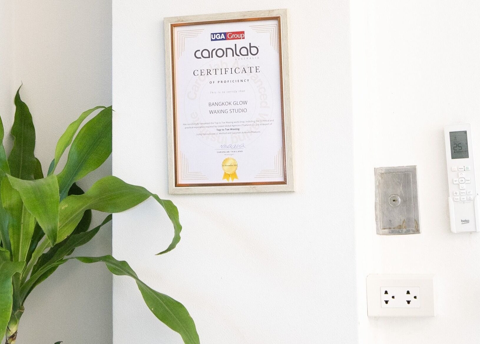 Certification of proficiency displayed at Bangkok Glow Waxing Studio, Krung Thep Maha Nakhon.