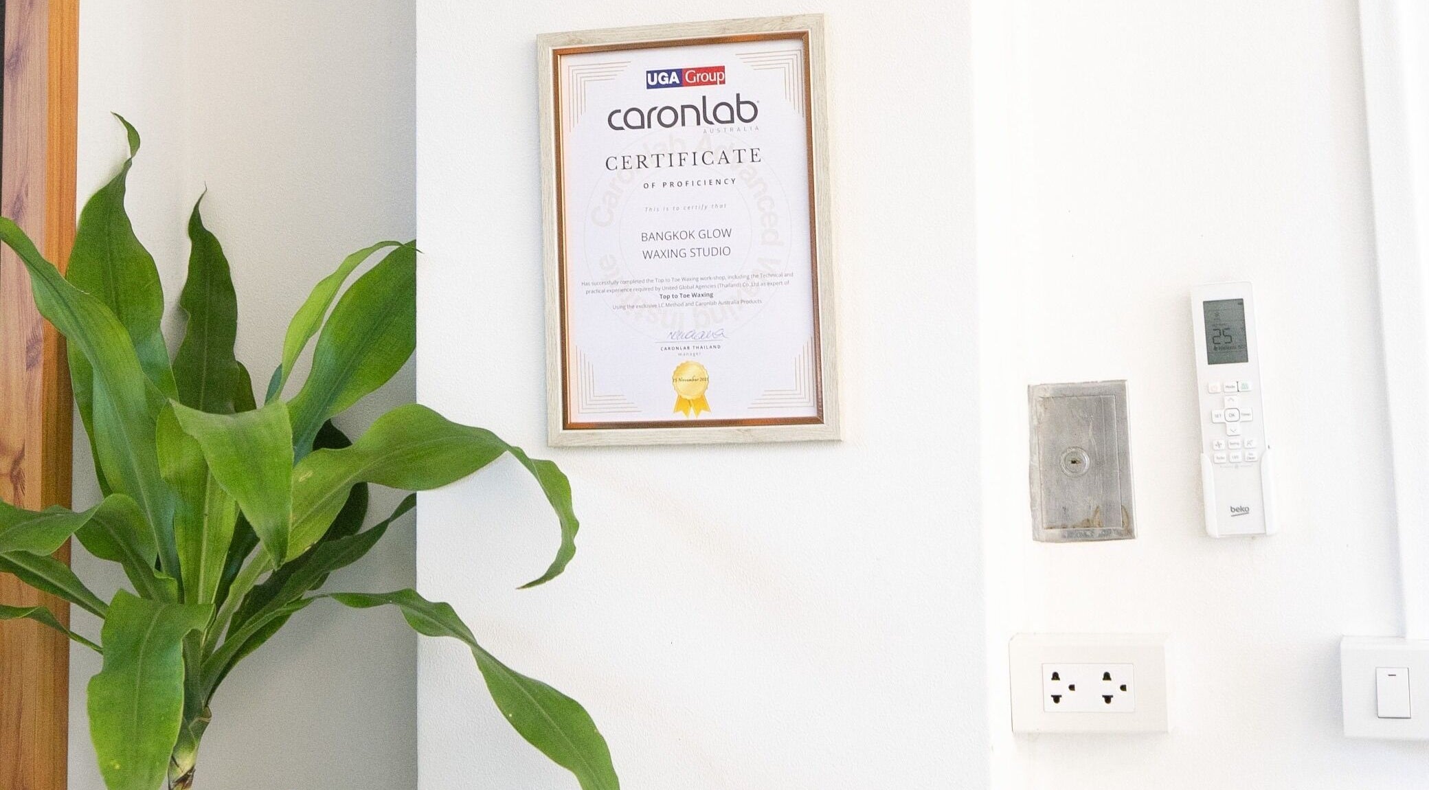 Certification of proficiency displayed at Bangkok Glow Waxing Studio, Krung Thep Maha Nakhon.