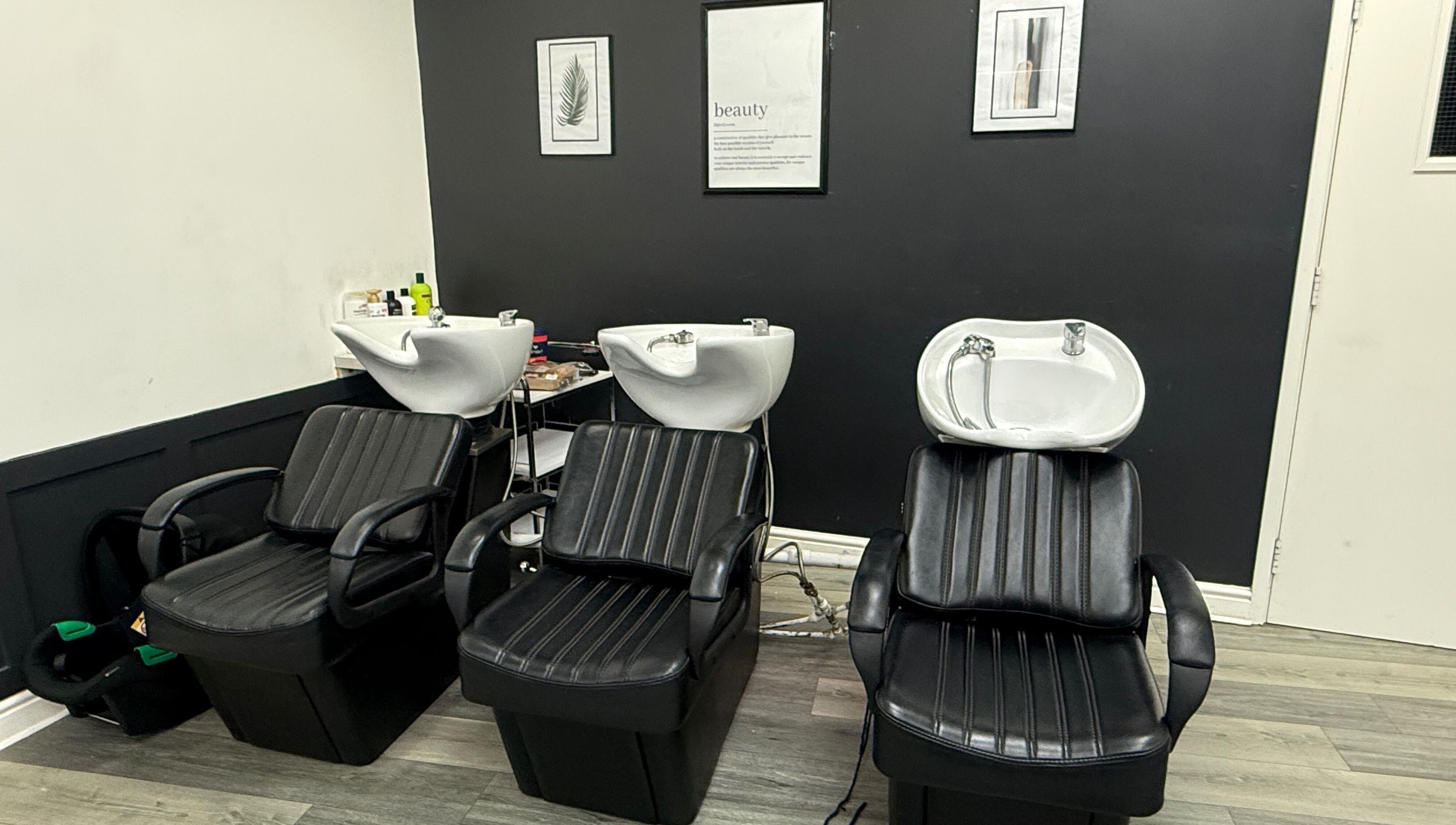Modern wash stations at Bim-Gold hair and beauty salon in Huddersfield, England, GB.