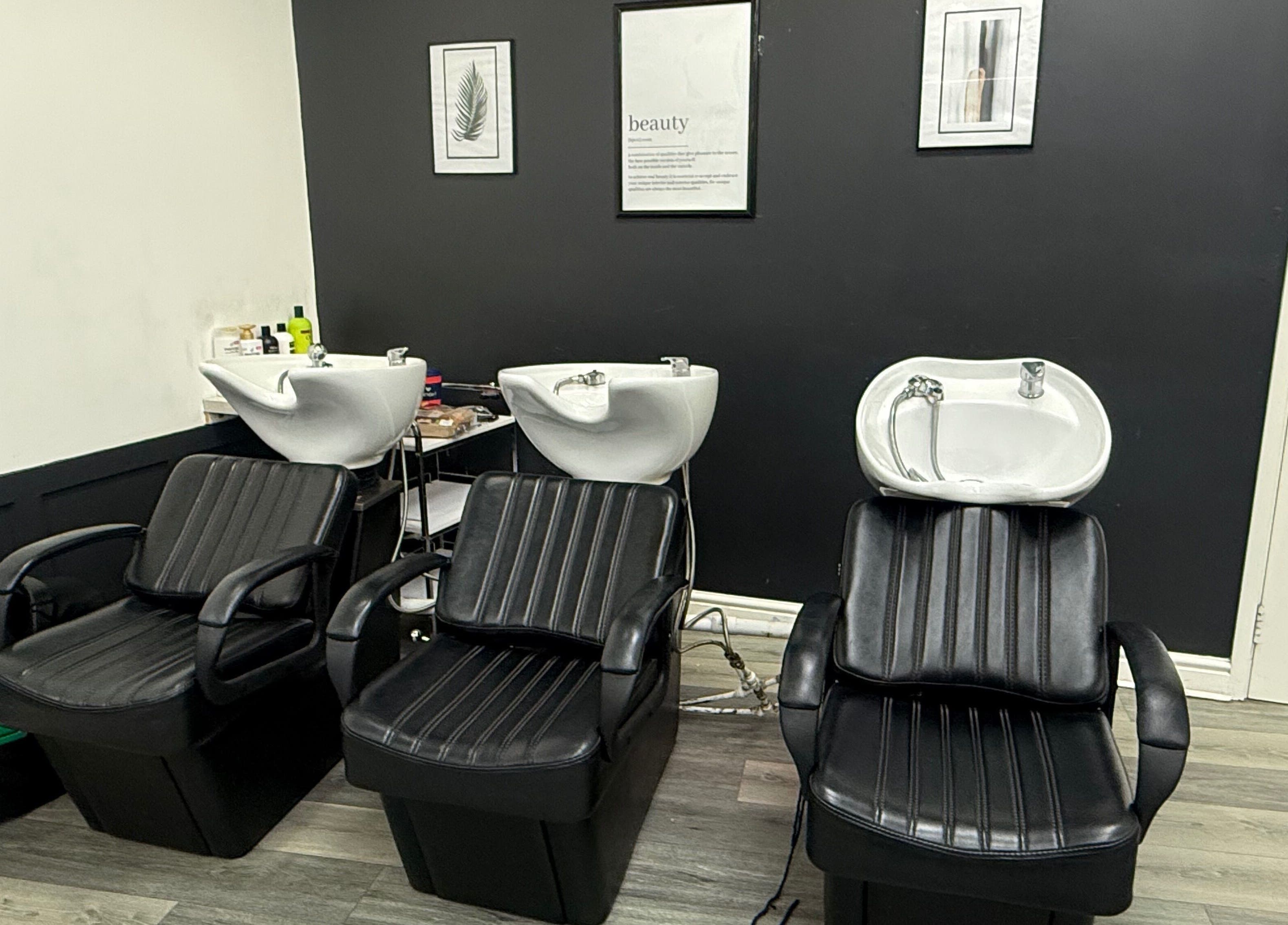 Modern wash stations at Bim-Gold hair and beauty salon in Huddersfield, England, GB.