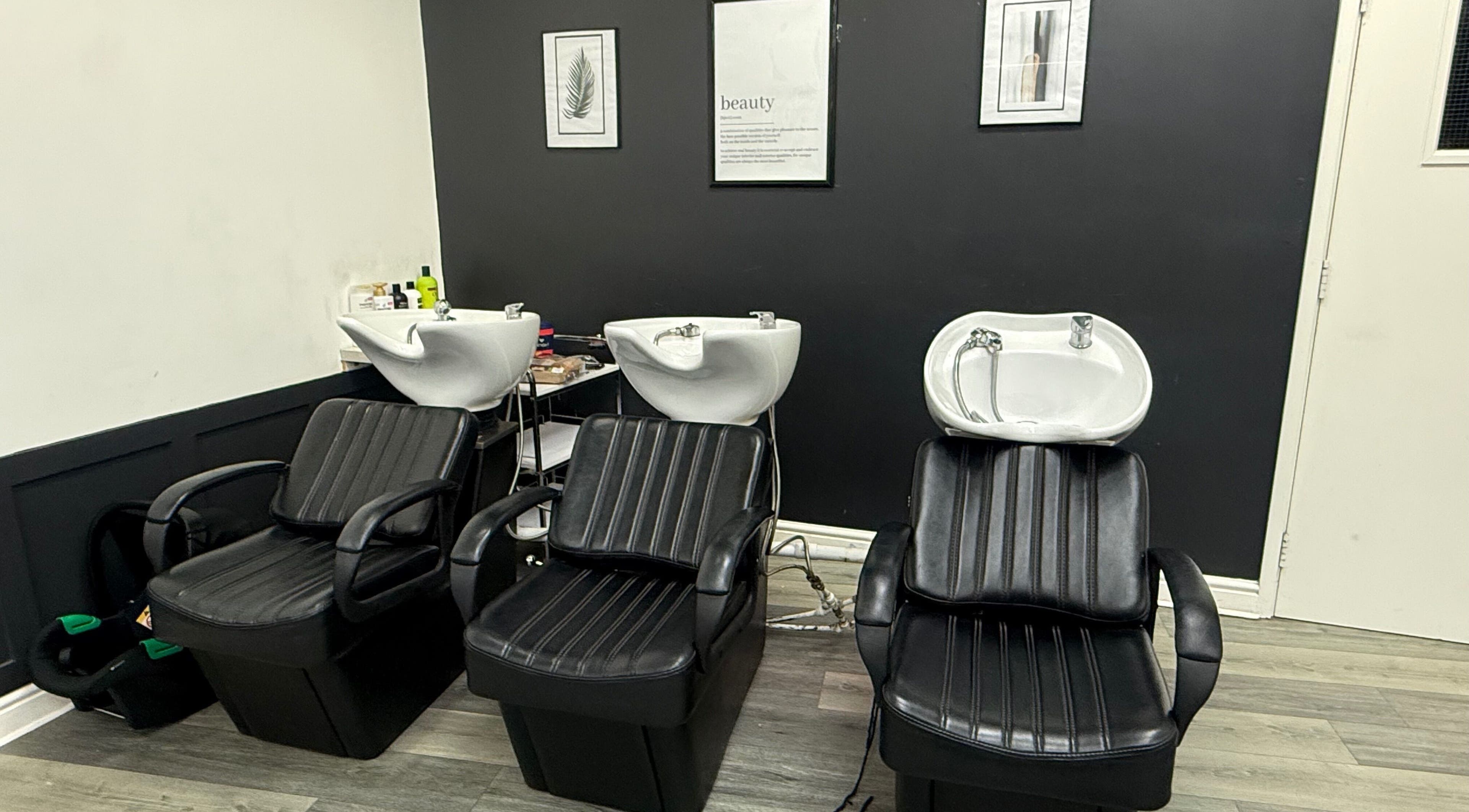 Modern wash stations at Bim-Gold hair and beauty salon in Huddersfield, England, GB.
