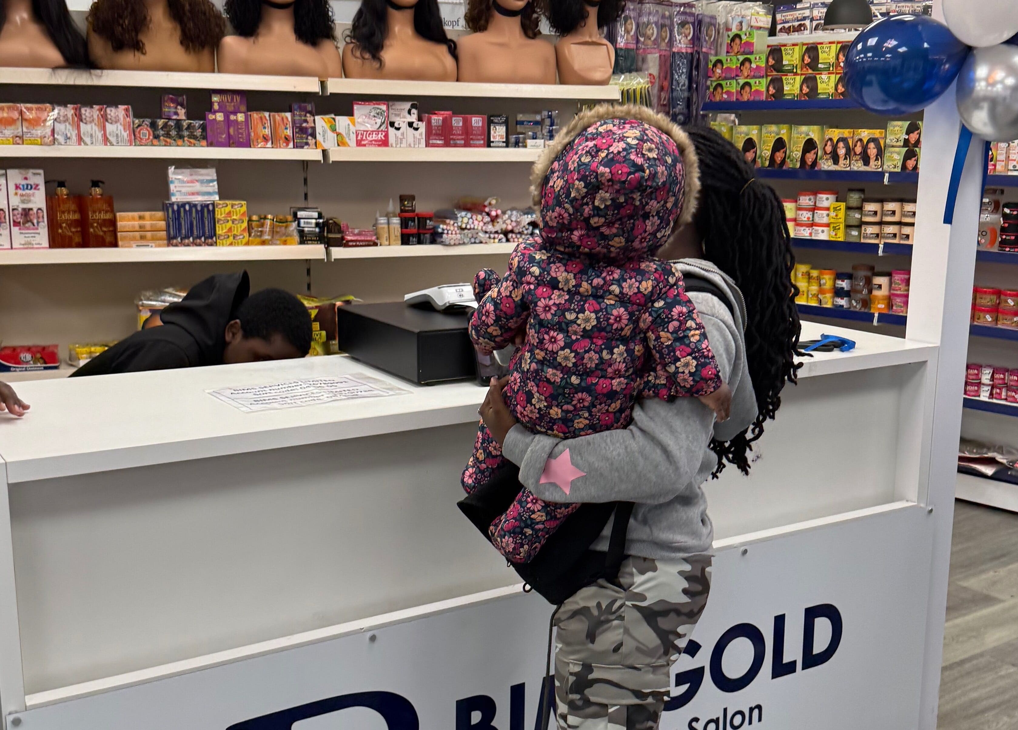 Warm customer interaction at Bim-Gold hair and beauty salon in Huddersfield, England, GB.