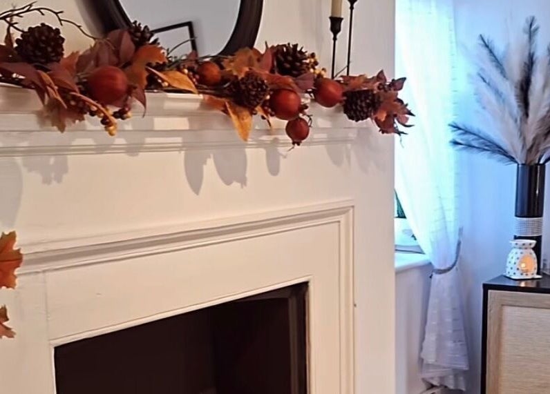 Elegant autumn mantel display at Chelsea Louise, Caistor, England, GB, featuring warm foliage accents.