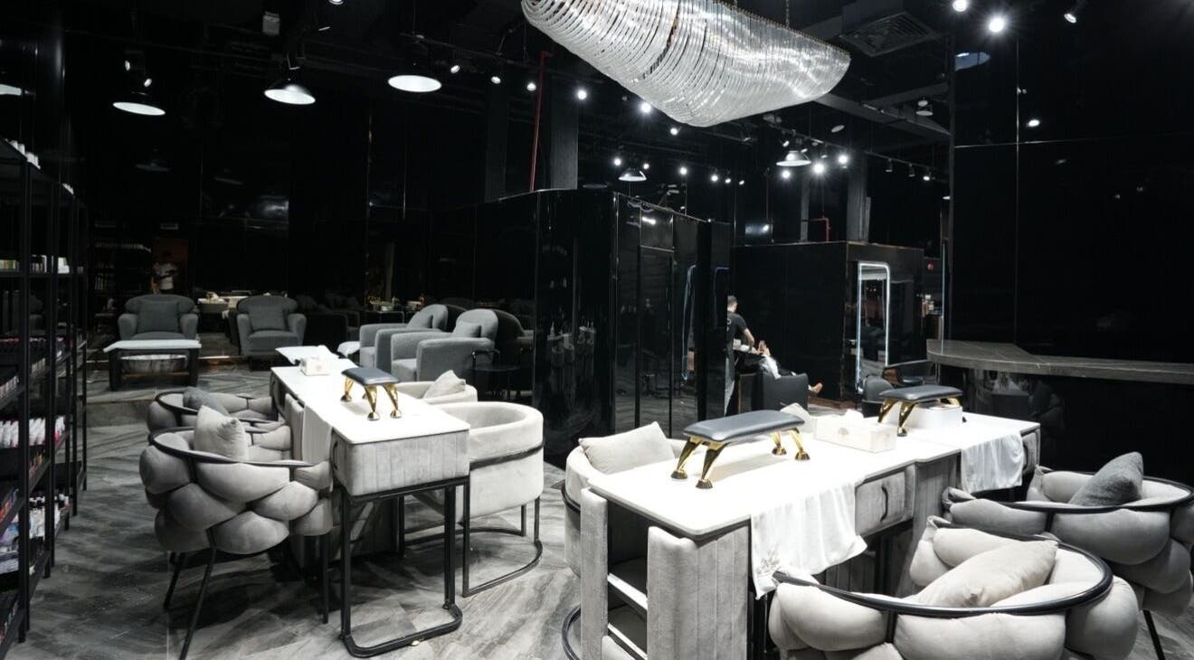Elegant interior of Dolche House Beauty Lounge in Dubai, AE, featuring plush seating and modern decor.