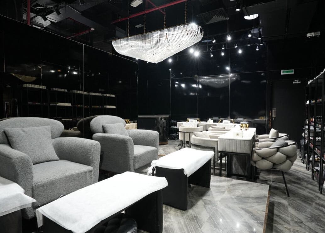 Luxurious interior of Dolche House Beauty Lounge, Dubai, AE showcasing plush seating and modern elegance.