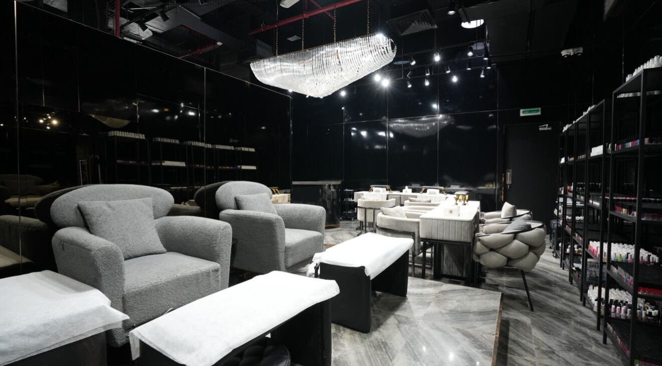 Luxurious interior of Dolche House Beauty Lounge, Dubai, AE showcasing plush seating and modern elegance.
