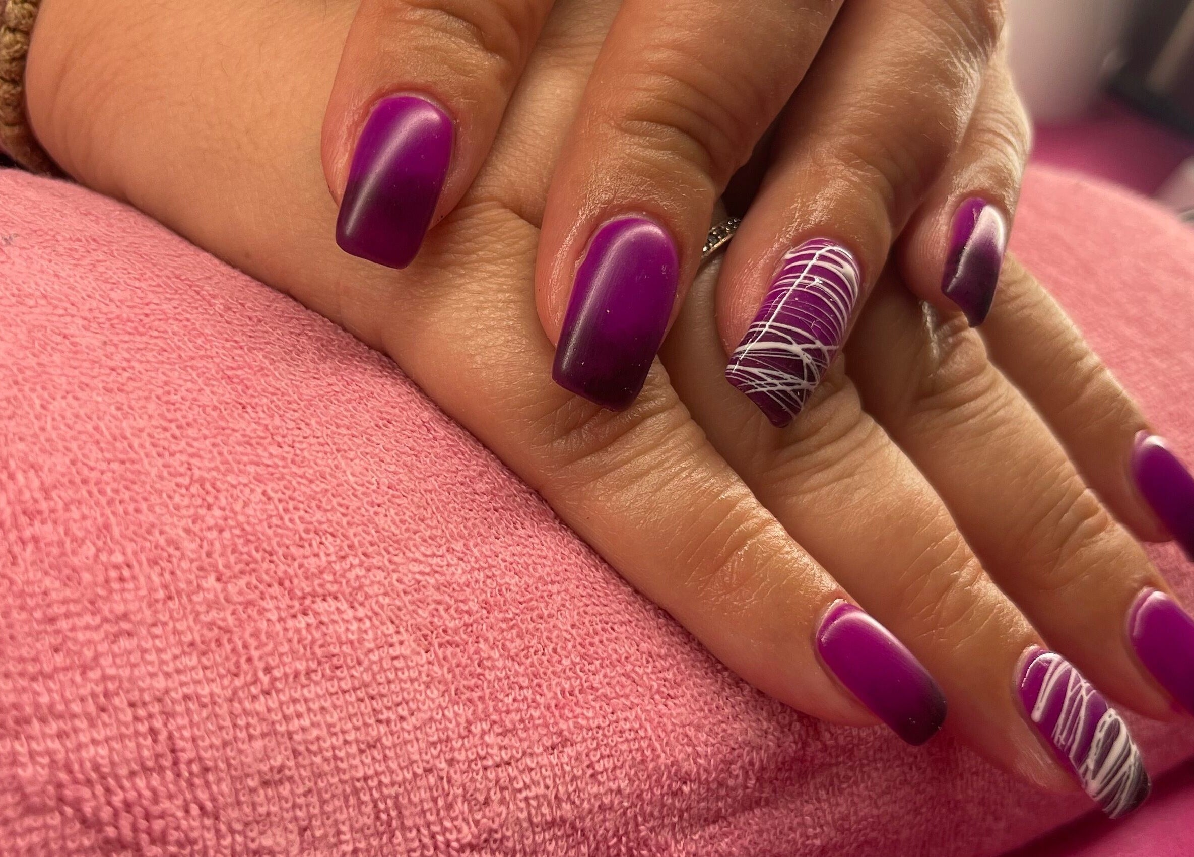 Vibrant purple manicure with artistic patterns at Vasso Hair Studio & Beauty, Egkomi Lefkosias, Lefkosia, CY.
