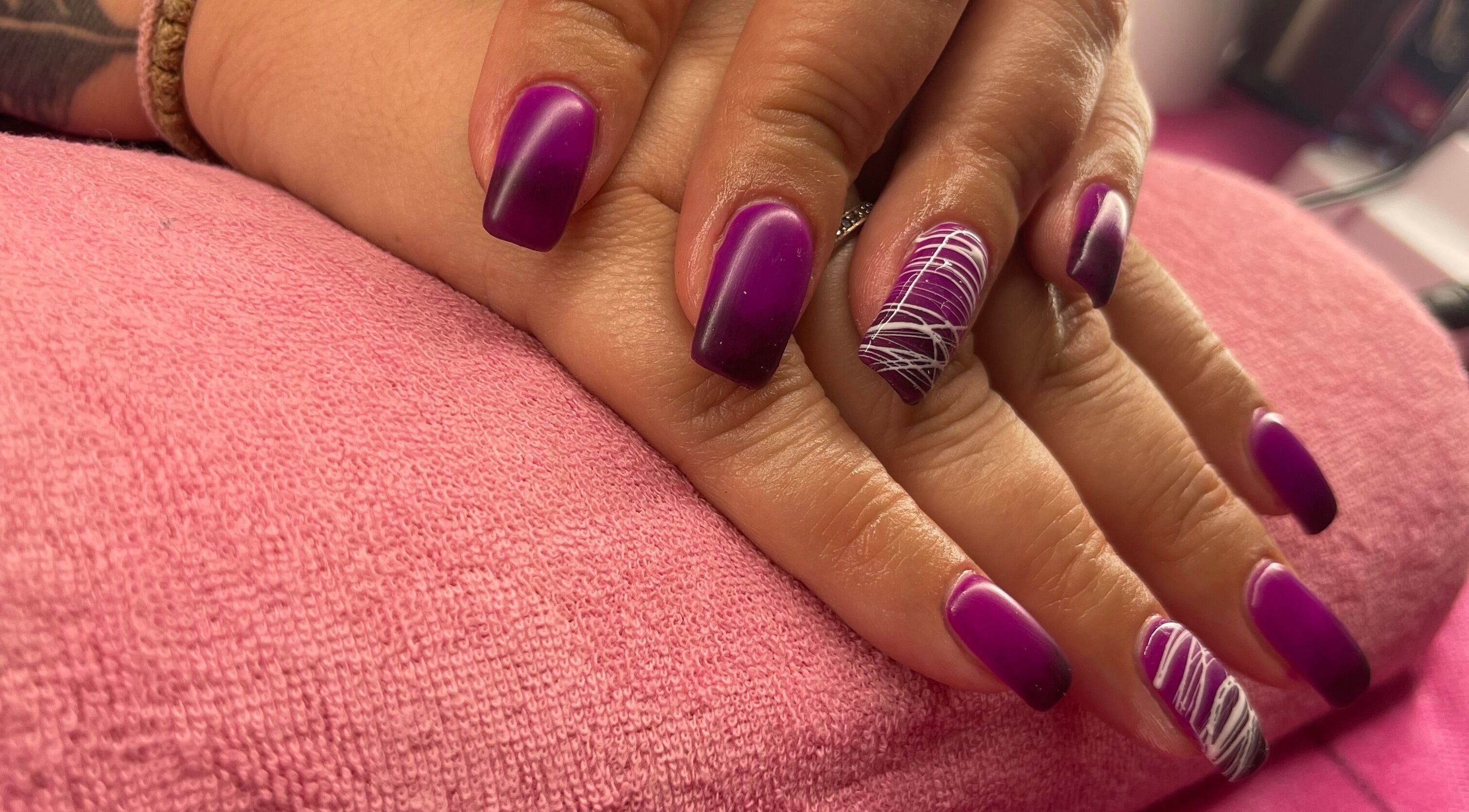 Vibrant purple manicure with artistic patterns at Vasso Hair Studio & Beauty, Egkomi Lefkosias, Lefkosia, CY.