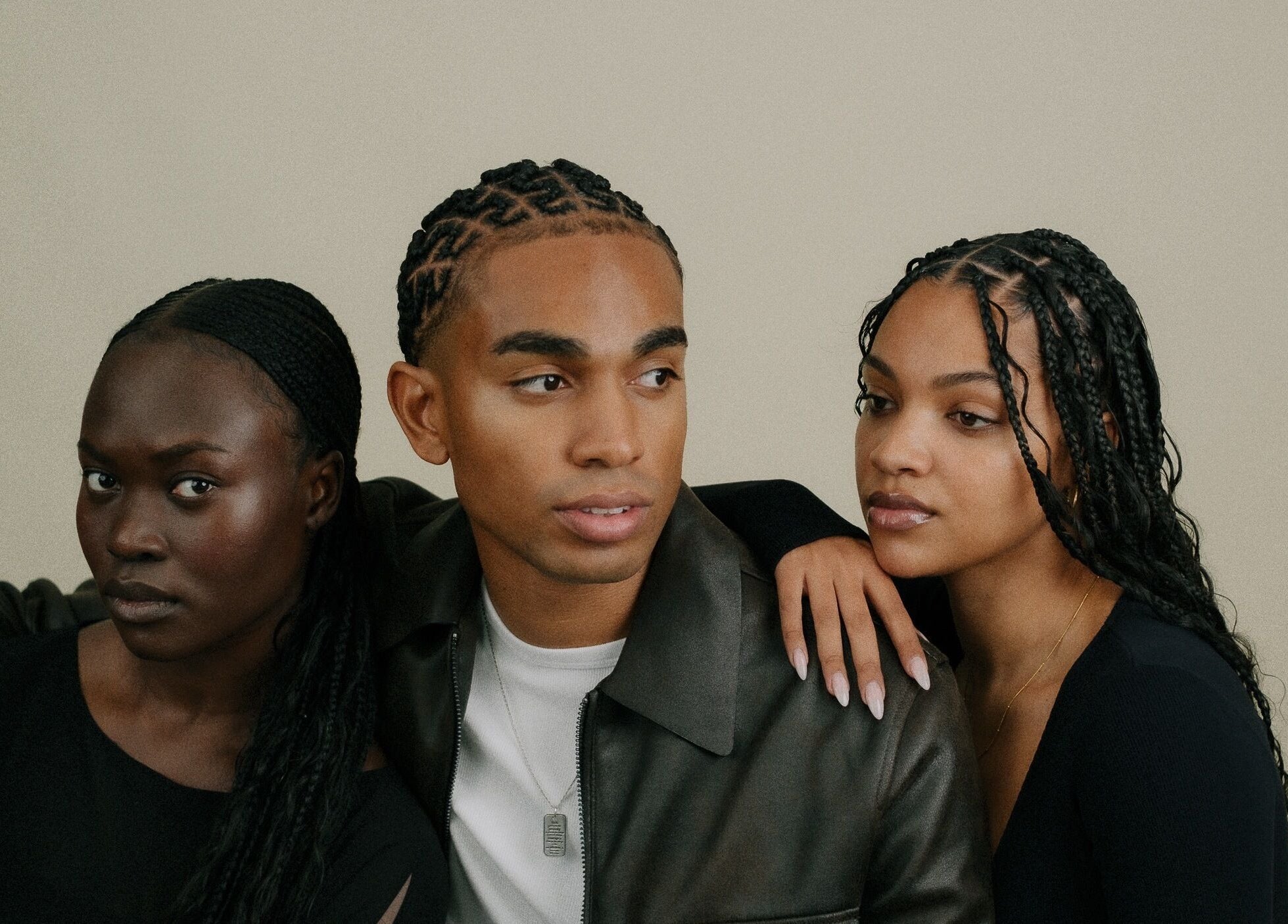 Three stylish individuals at BISADA in Wanneroo, Western Australia, AU showing diverse beauty with braided hairstyles.