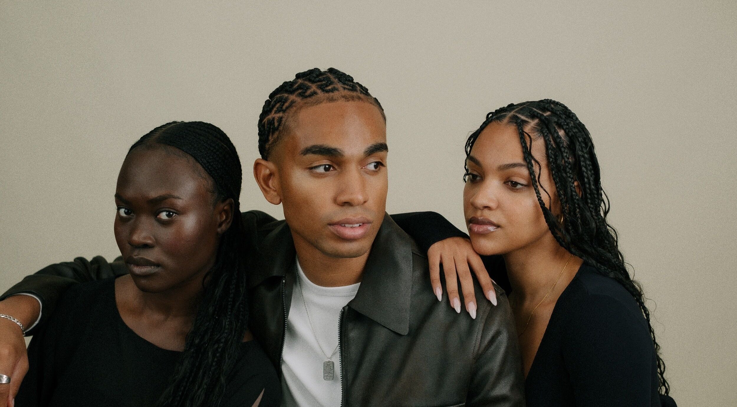 Three stylish individuals at BISADA in Wanneroo, Western Australia, AU showing diverse beauty with braided hairstyles.