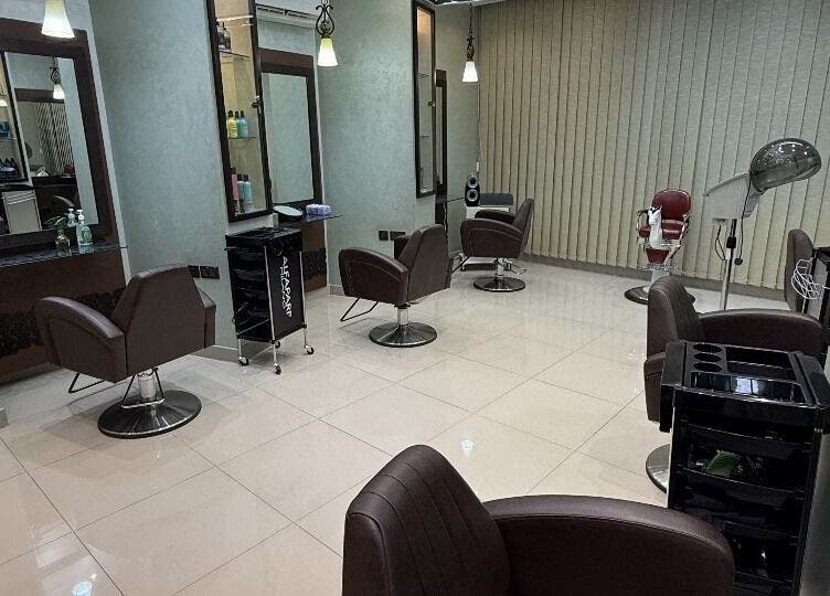 Chic interior of Rouge and Henna Beauty Saloon and Spa in Al Ain, Abu Dhabi, AE. Modern styling station setup.