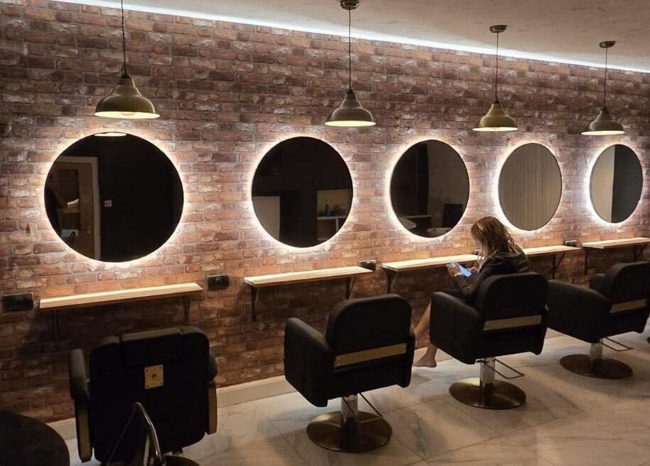 Elegant salon mirrors and seating at Sophie Hair Artist in Thetford, England, GB.