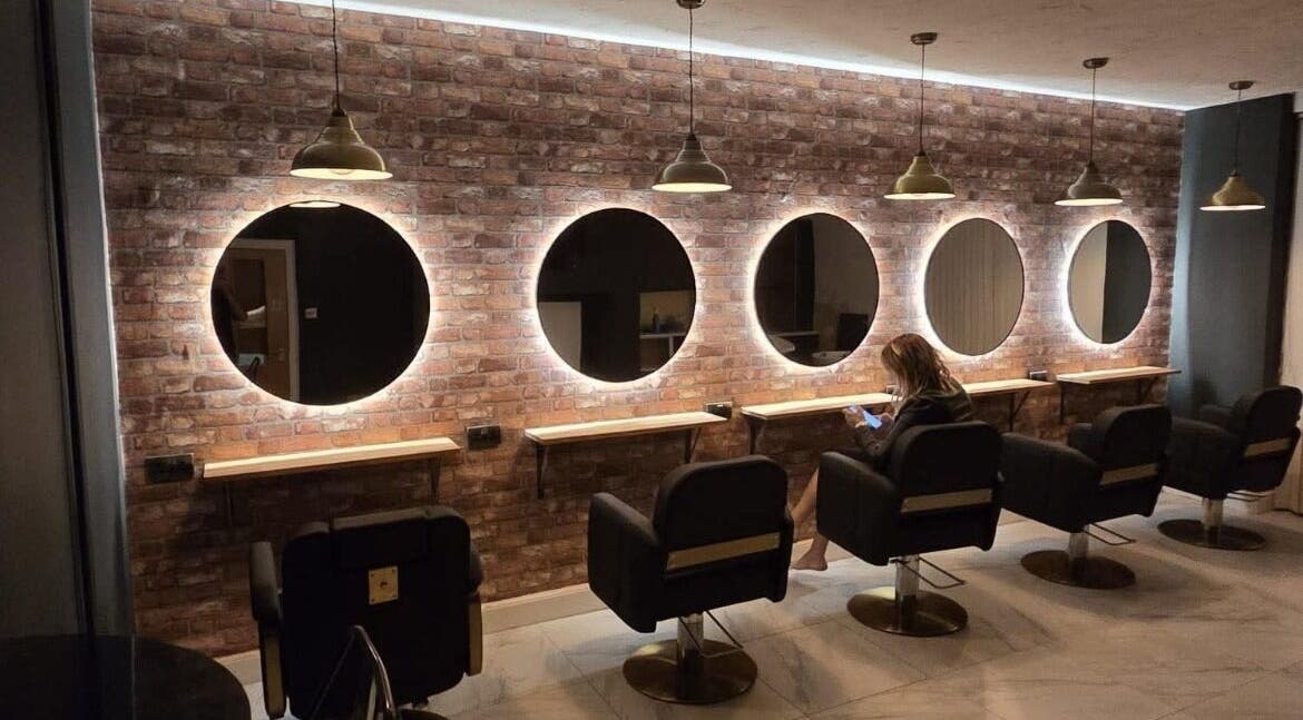 Elegant salon mirrors and seating at Sophie Hair Artist in Thetford, England, GB.