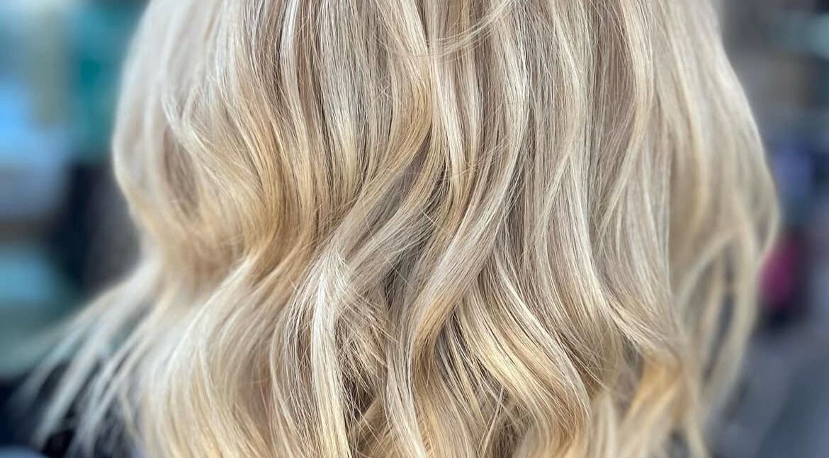 Blonde wavy hairstyle at Sophie Hair Artist, Thetford, England, GB, showcasing expert styling techniques.