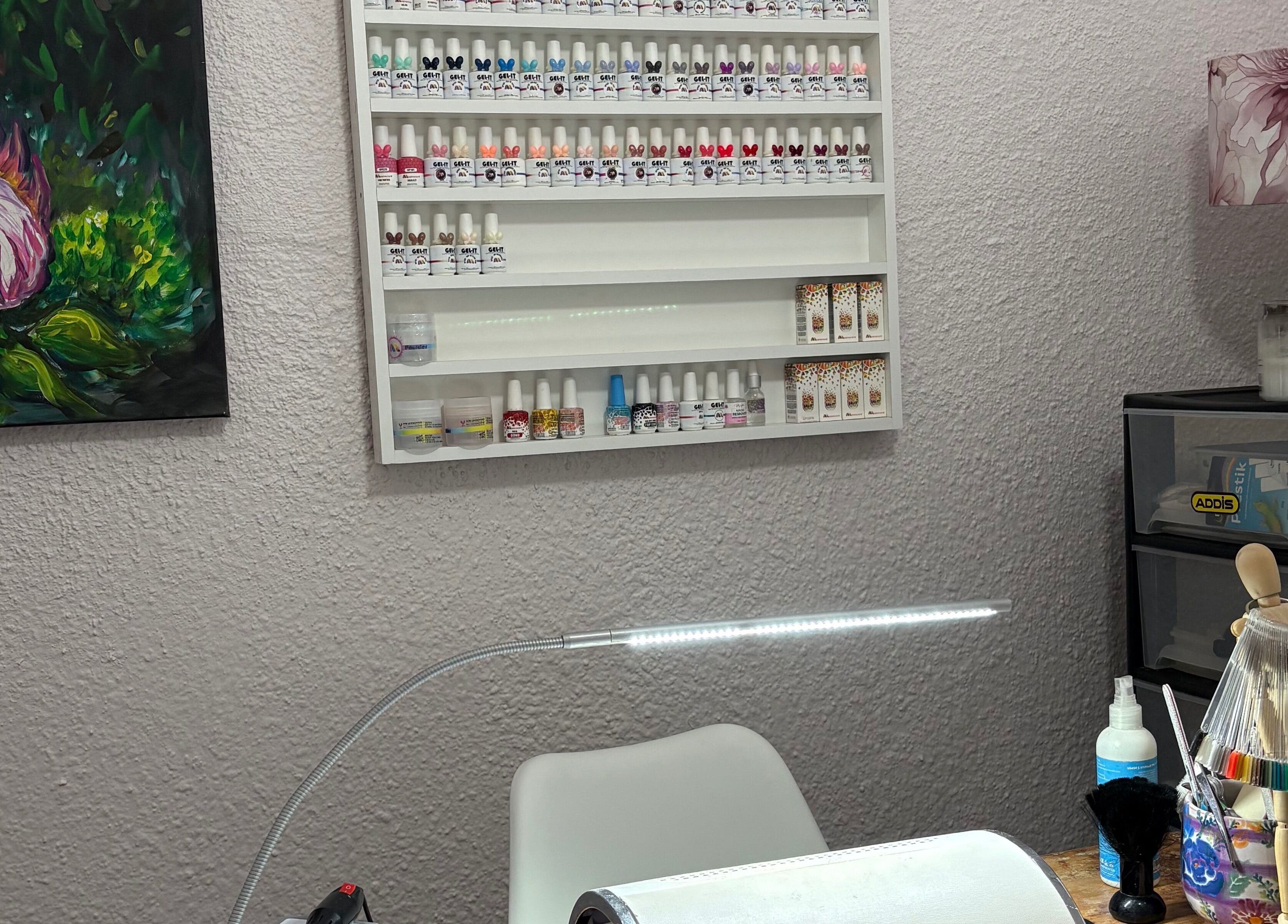 Cozy interior of 10Ten Nail Salon, Paarl, ZA with nail polish display and artistic decor.