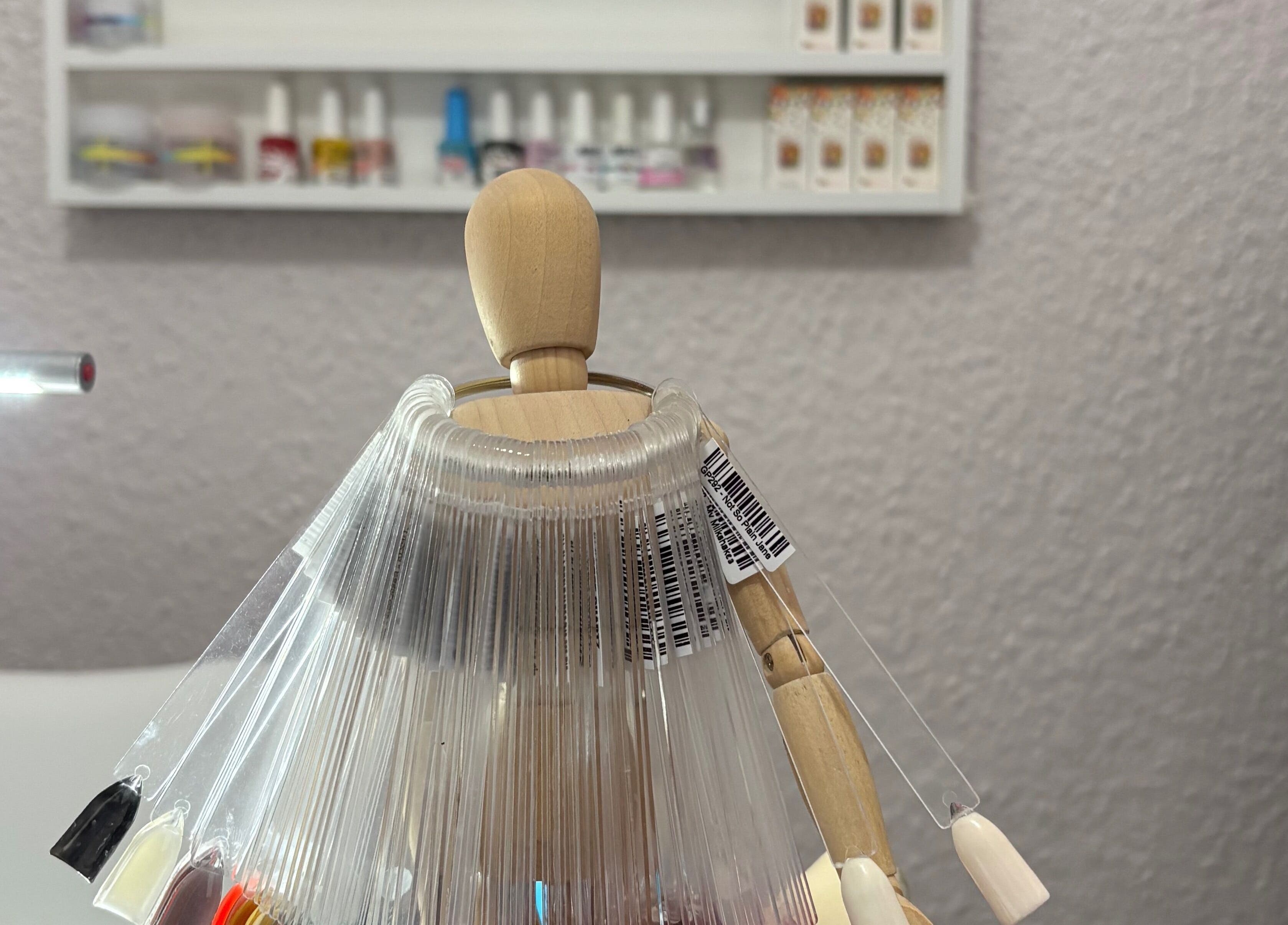 Nail color samples at 10Ten Nail Salon in Paarl, Western Cape, ZA. Brightly lit, modern manicure setup.