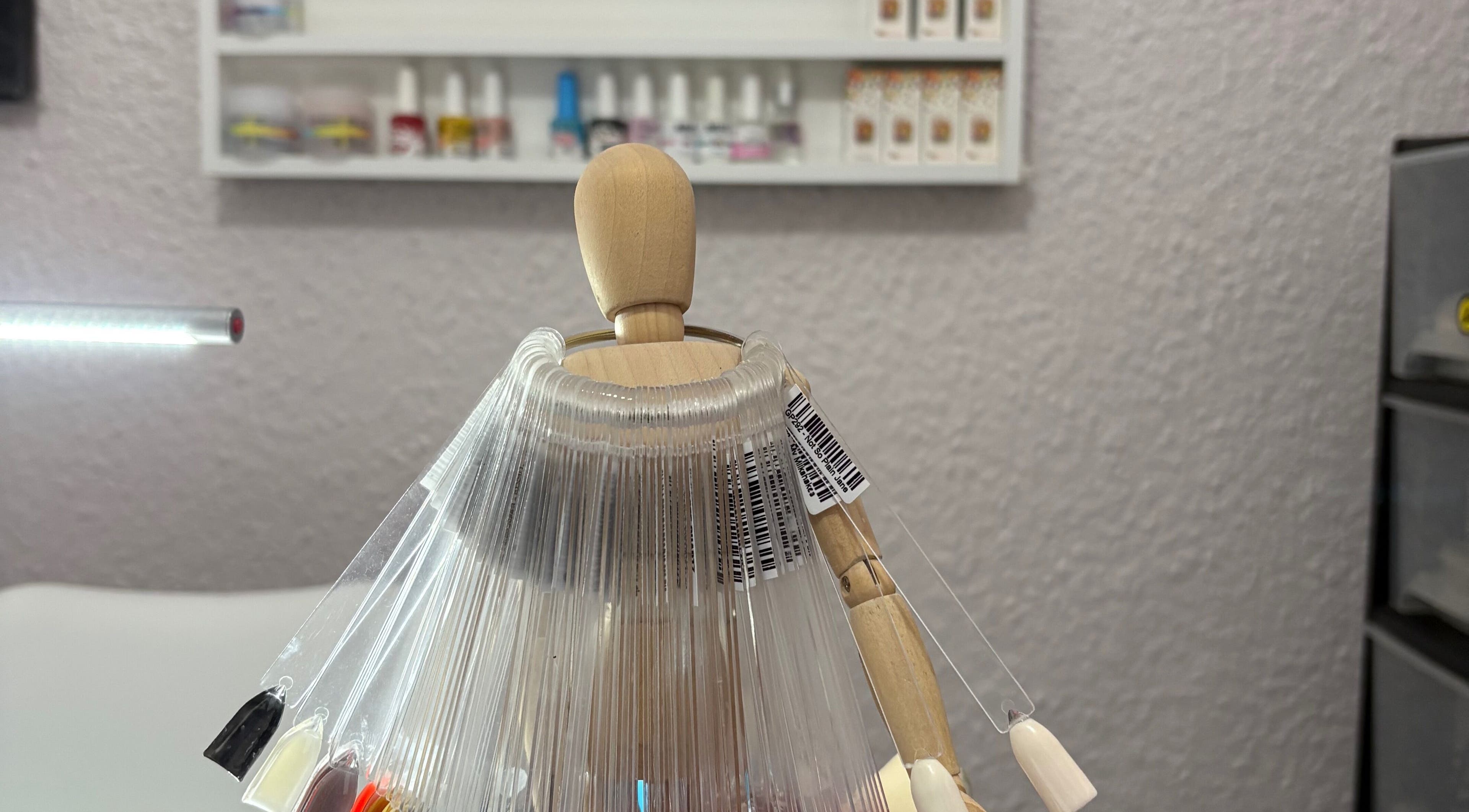 Nail color samples at 10Ten Nail Salon in Paarl, Western Cape, ZA. Brightly lit, modern manicure setup.