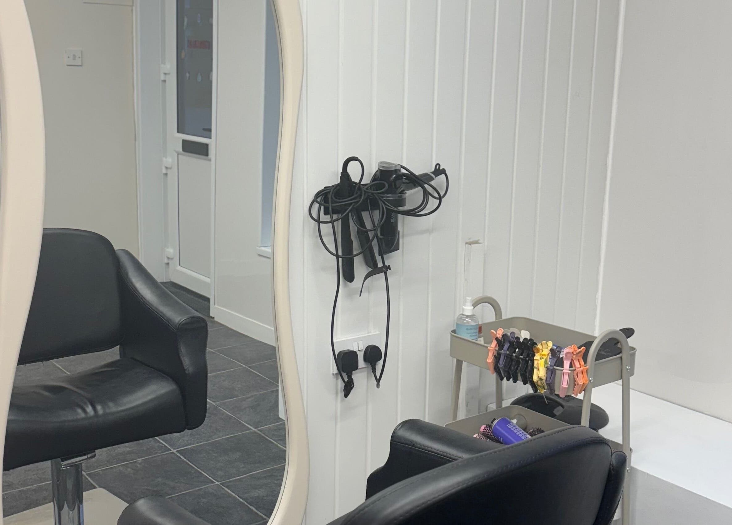 Modern styling chair and tools at Signature By Lou, Ilkeston, England, GB.