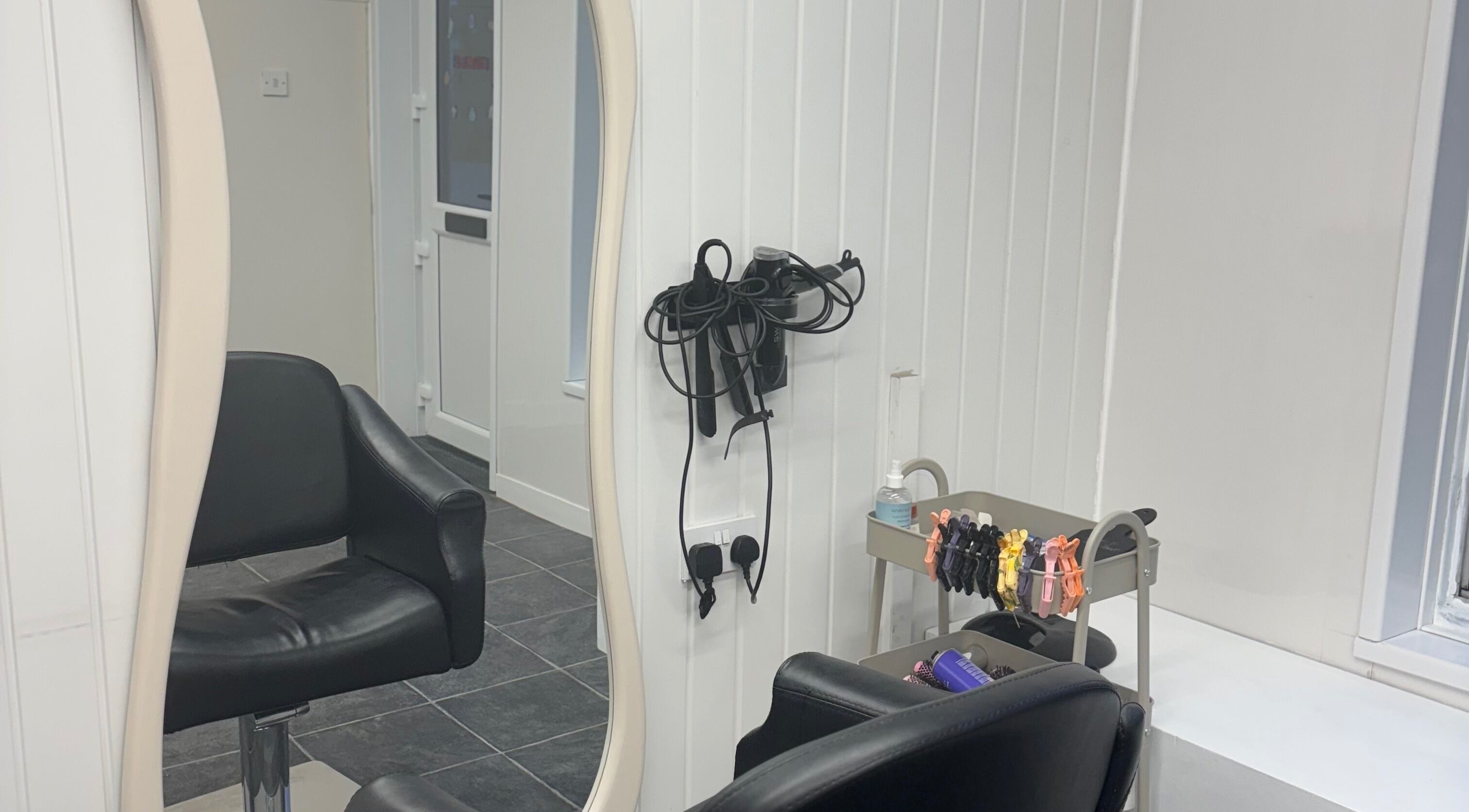 Modern styling chair and tools at Signature By Lou, Ilkeston, England, GB.