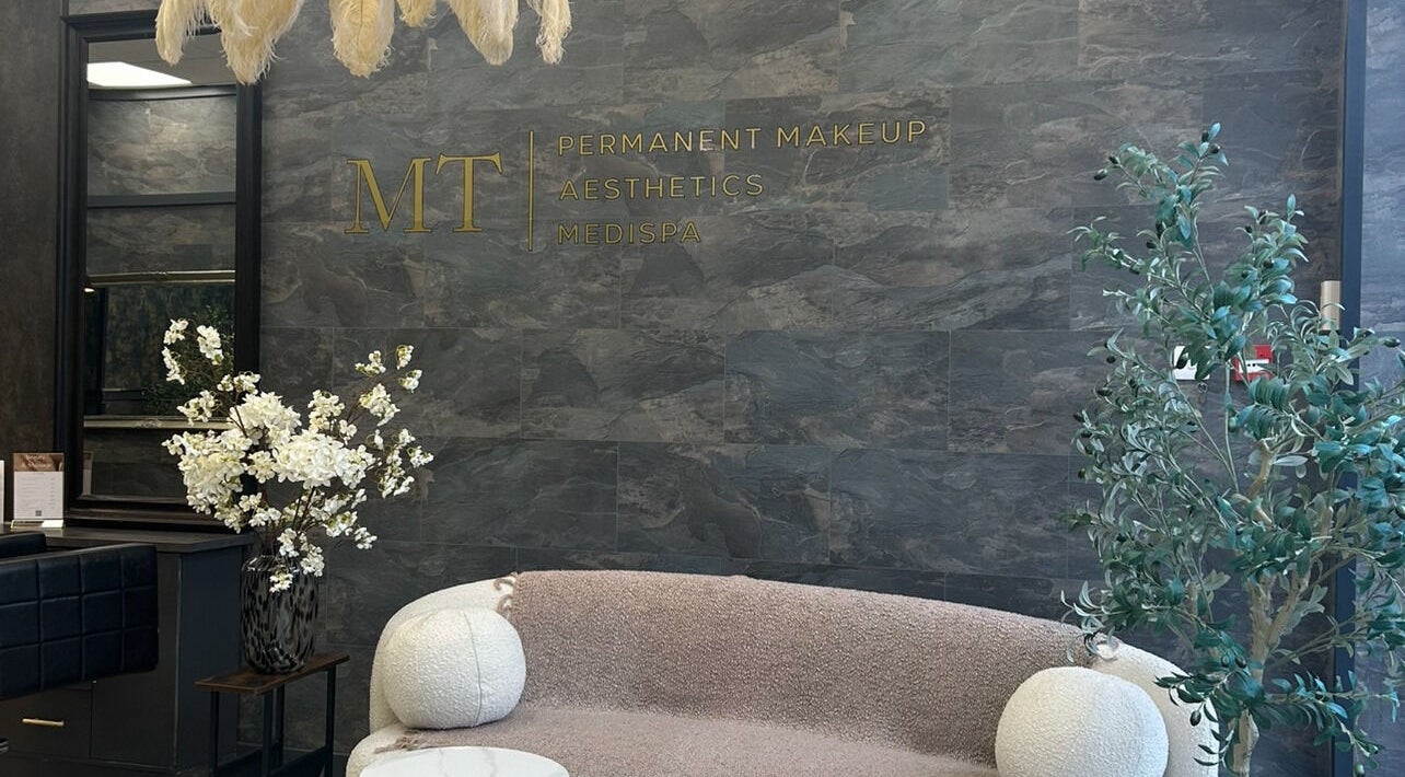 Chic seating area at Beauty by Leanne, Southampton, England, GB with modern decor and elegant flowers.