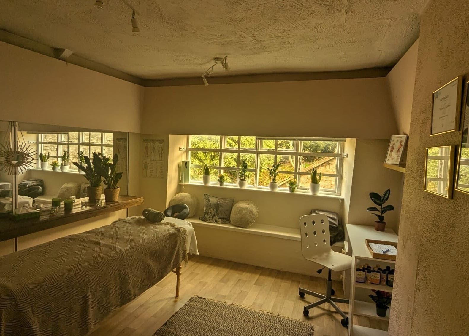 Relaxing massage room at Lexa Massage Studio, Keynsham, England, featuring calming decor and natural light.