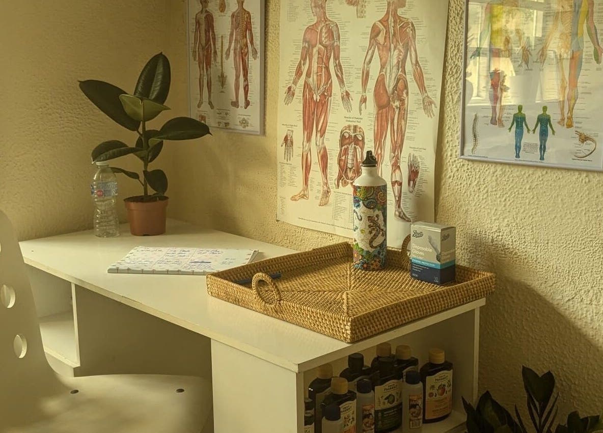 Lexa Massage Studio's relaxing workspace with anatomical charts in Keynsham, England, GB.