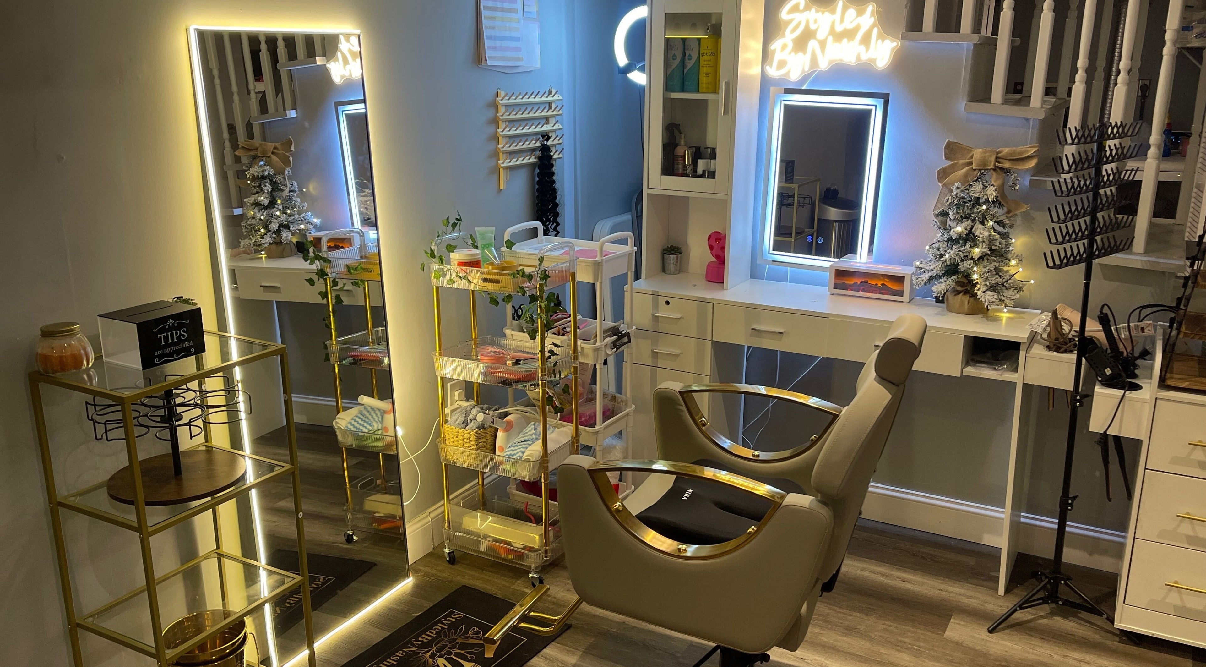 Modern styling station at Styled.byNashly in Allentown, Pennsylvania, US, with mirror and decor.