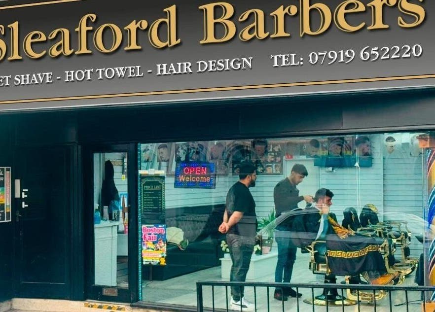 Exterior view of Sleaford Barbers in London, England, GB showcasing its welcoming, stylish atmosphere.