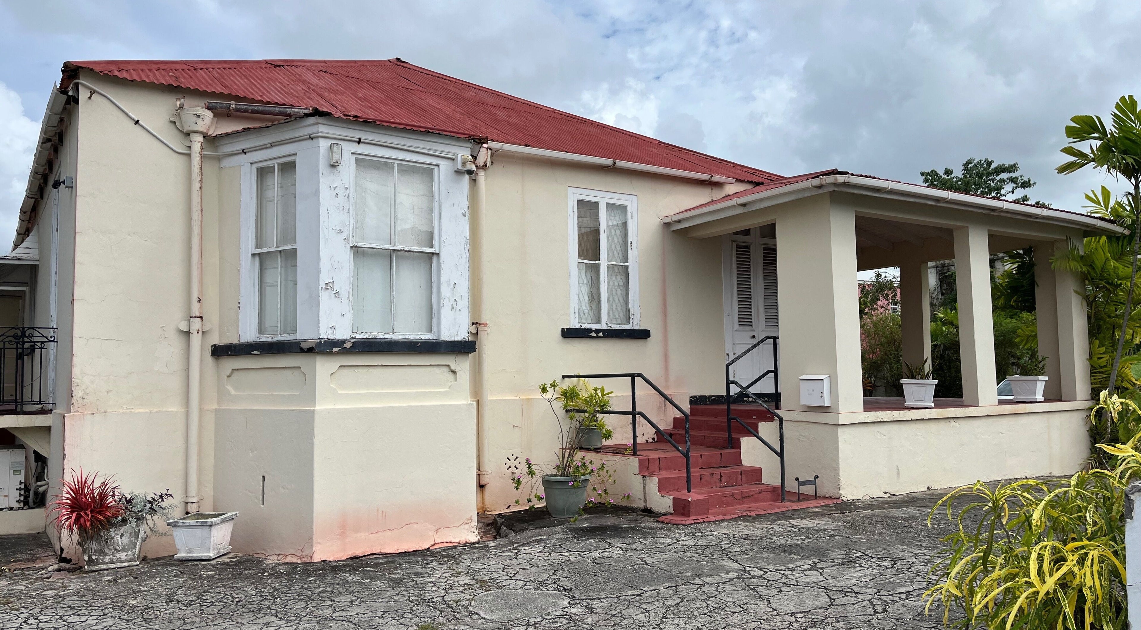 Front view of Kinetix Wellness venue in Bridgetown, Saint Michael, BB with rustic charm and lush greenery.