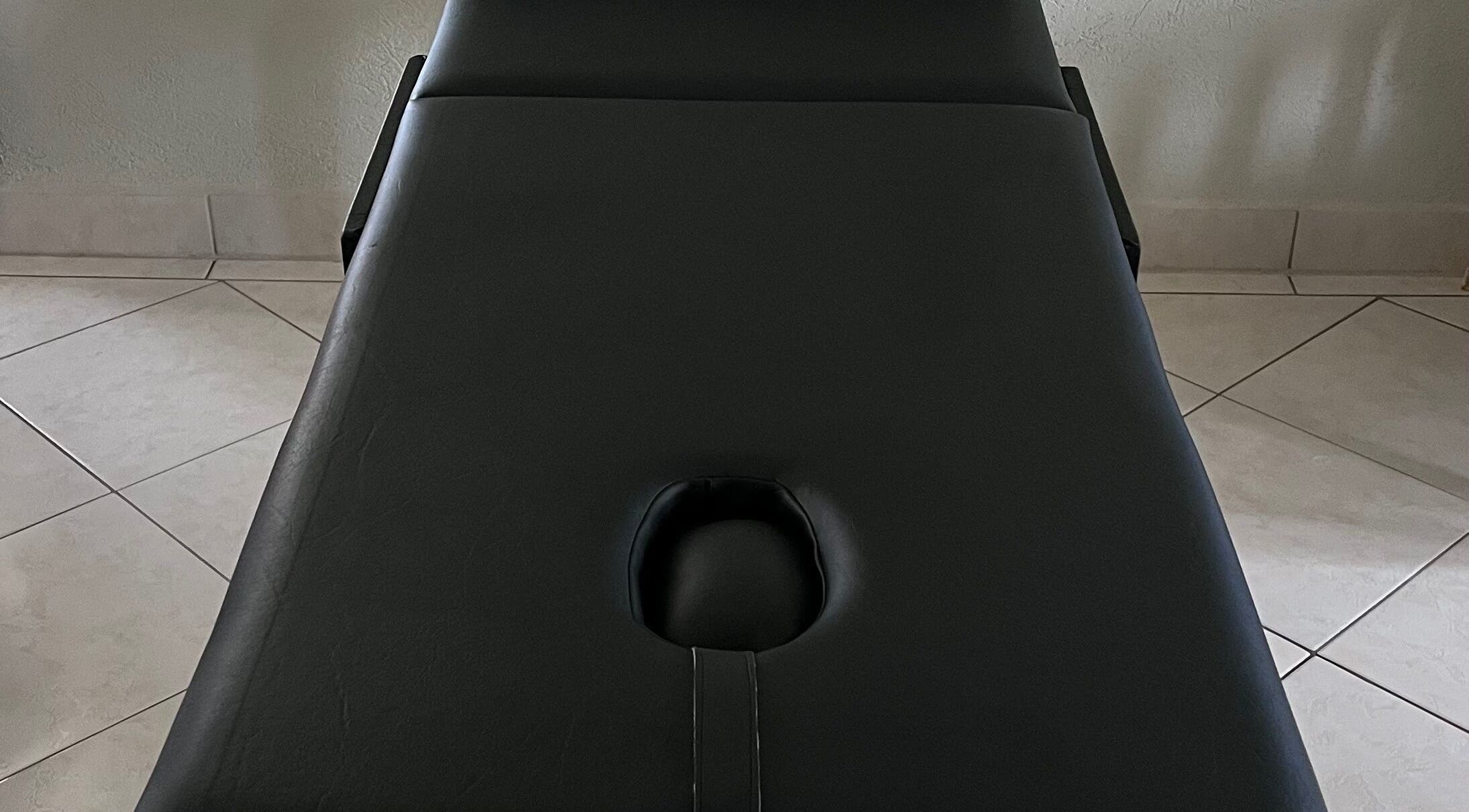 Comfortable massage table at Kinetix Wellness, Bridgetown, Saint Michael, BB, ideal for relaxation.