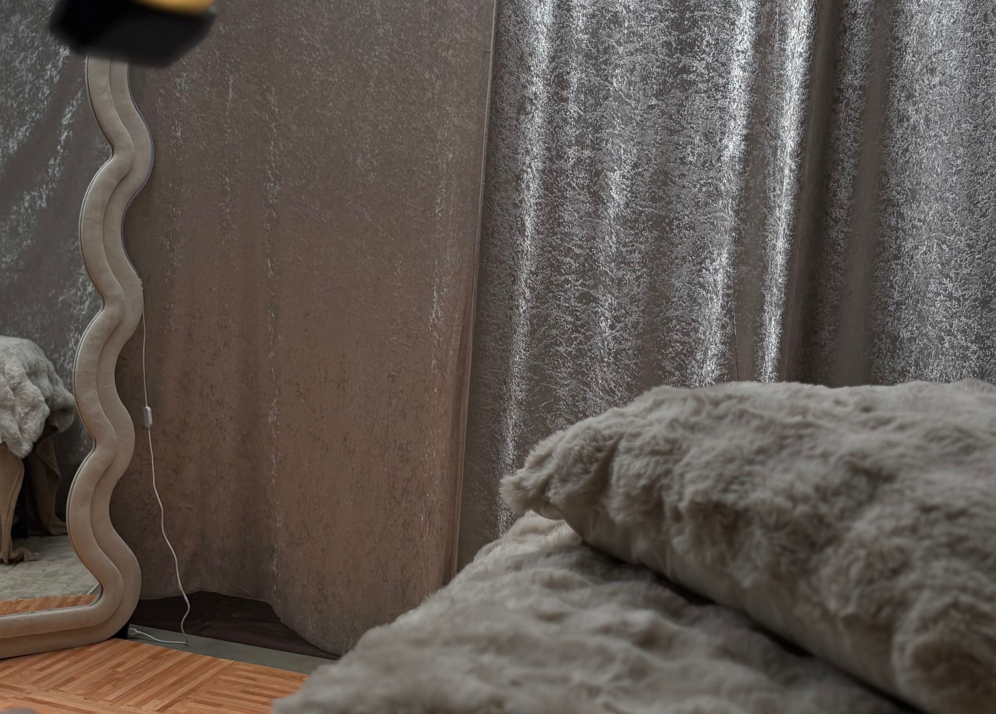 Inviting space at Lashed By Mirai in Ravenswood, Tasmania with elegant mirror and plush decor.